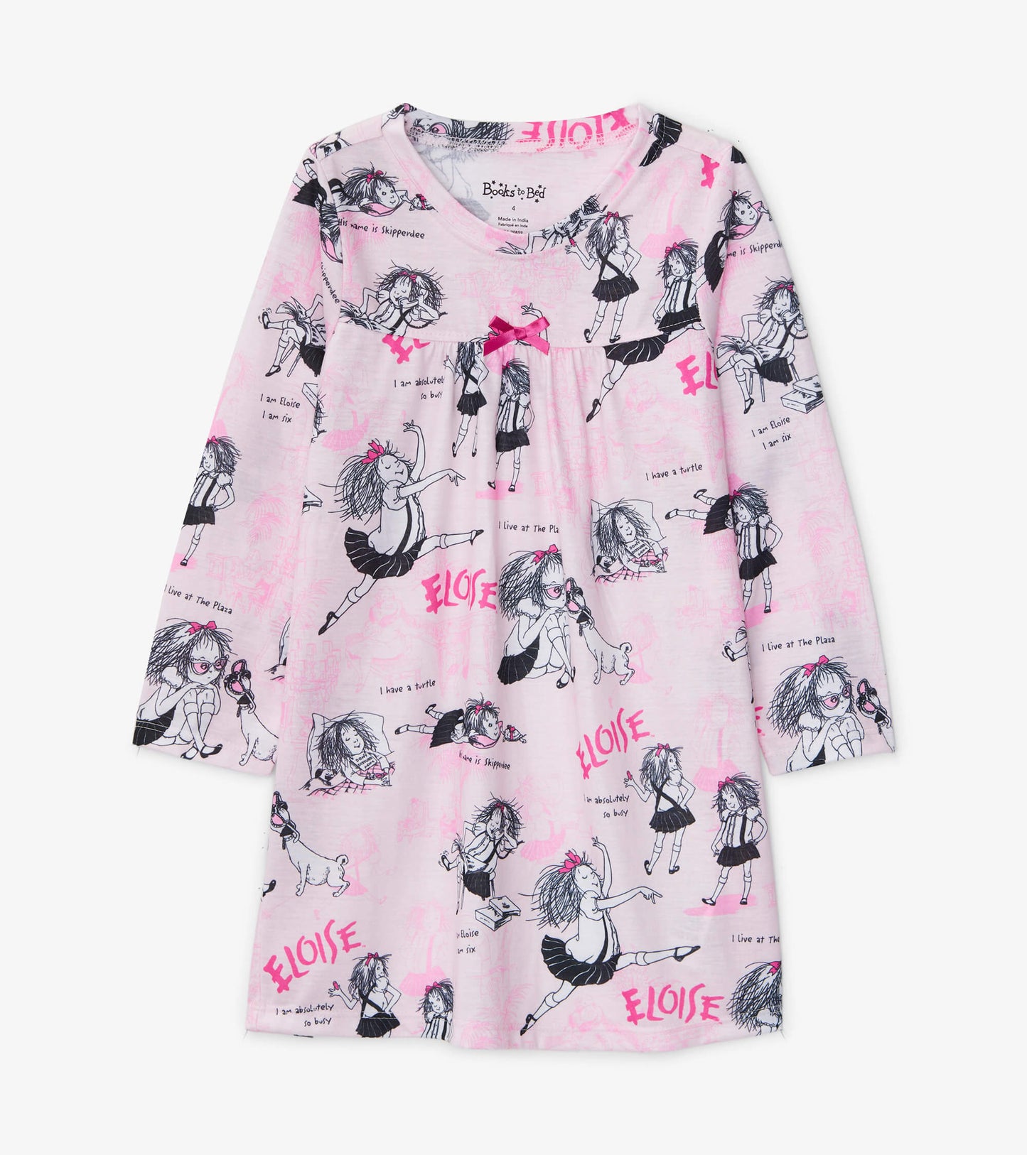 Pink long-sleeve nightdress featuring playful black illustrations of a girl and text, with a small bow detail at the necklin…