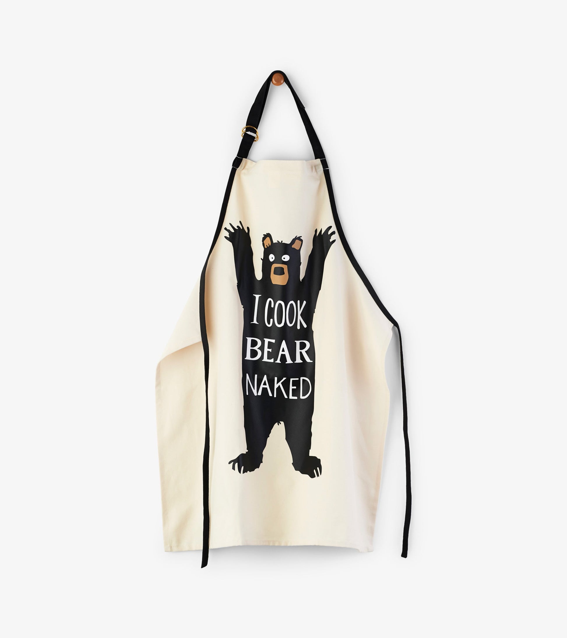 Cream apron featuring a playful bear graphic with the text "I COOK BEAR NAKED," adjustable black straps.