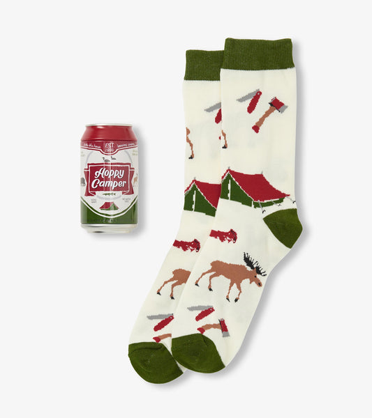 Cream socks with green accents featuring camping motifs like tents, moose, and beer cans. One size fits all.