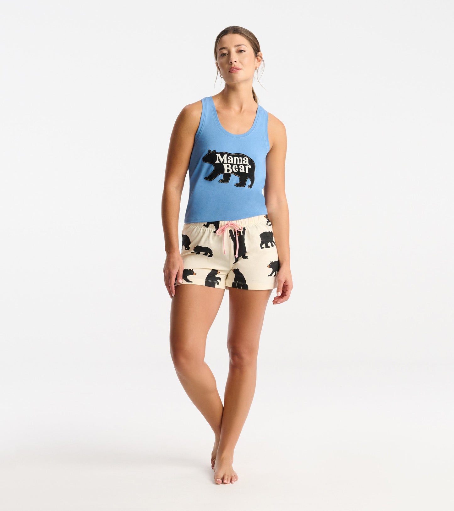 Black cotton sleep shorts featuring a bear pattern and a pink drawstring, styled with a blue tank top.