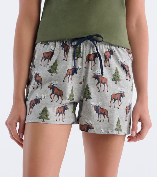 Gray cotton pajama shorts featuring a moose and tree pattern, with an elastic waistband and drawstring.