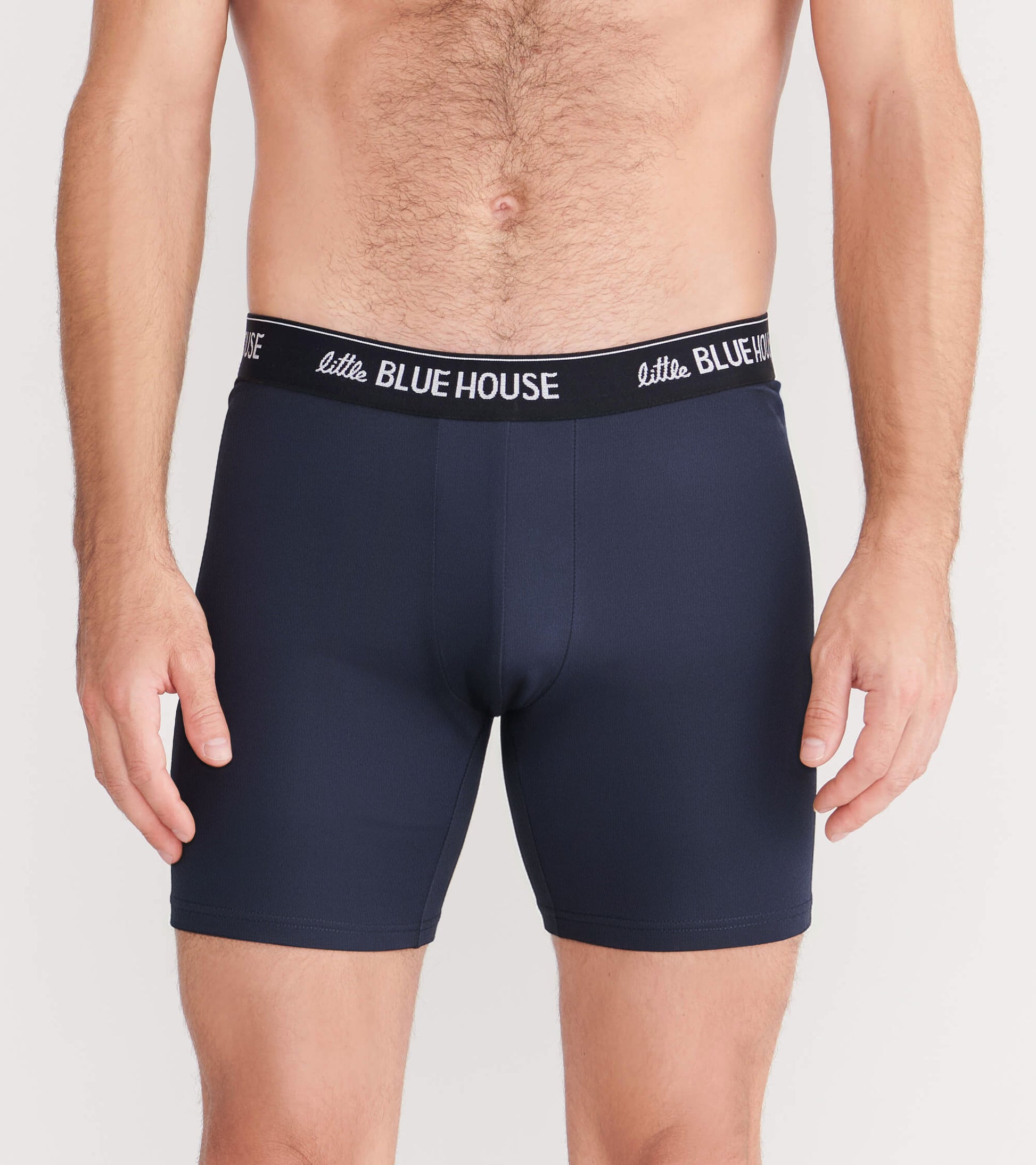Navy blue boxer briefs with a snug fit and a black waistband featuring white text.