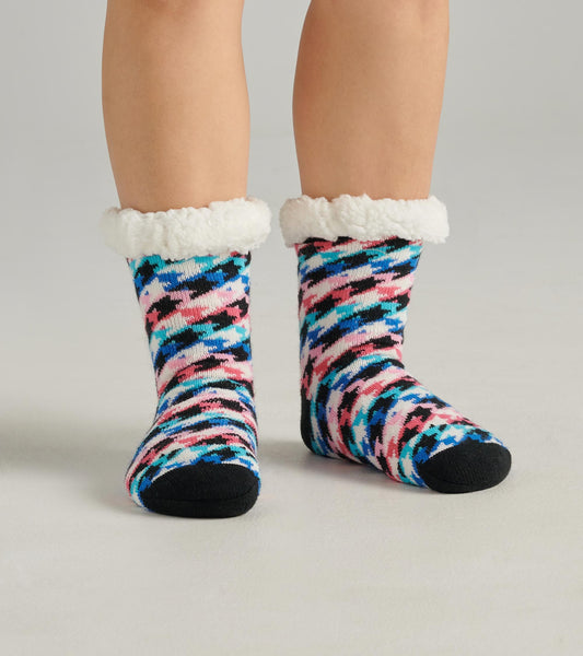 Colorful houndstooth pattern women's cabin socks with a soft white sherpa lining and black toe.