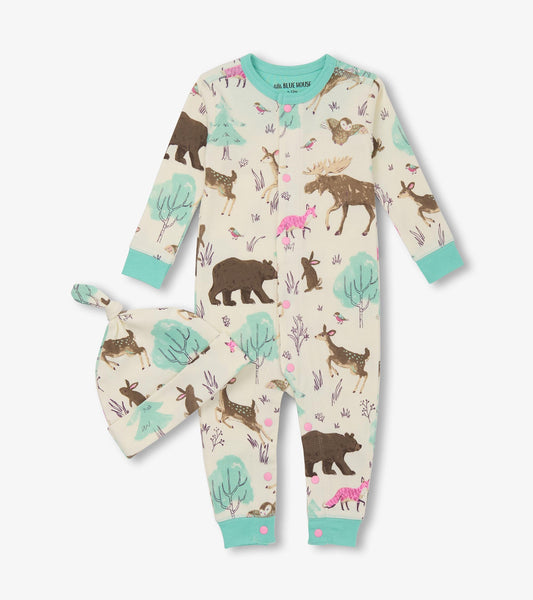 Cream-colored sleeper with forest animal prints, matching hat, and mint green accents. Suitable for baby girls.