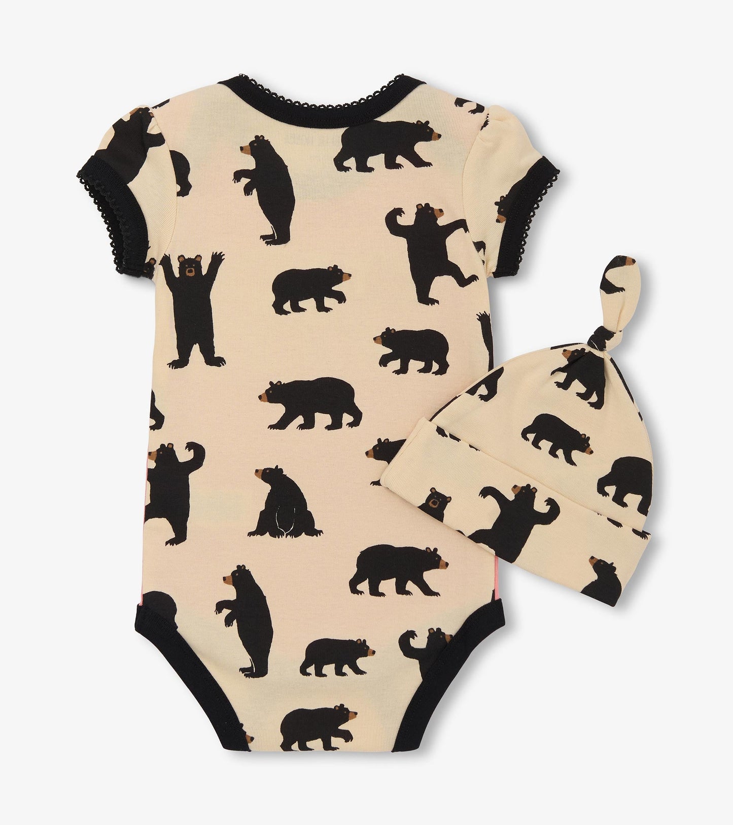 Pink bodysuit with black bear print and matching hat, featuring short sleeves and a snap closure at the bottom.