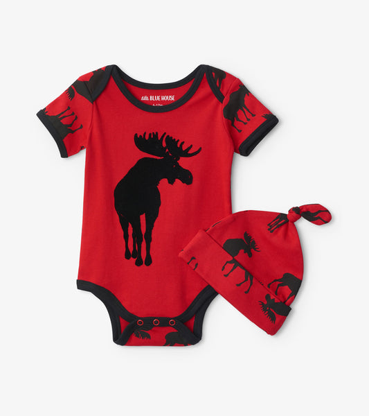 Red baby bodysuit featuring black moose graphics, paired with a matching moose-patterned hat.
