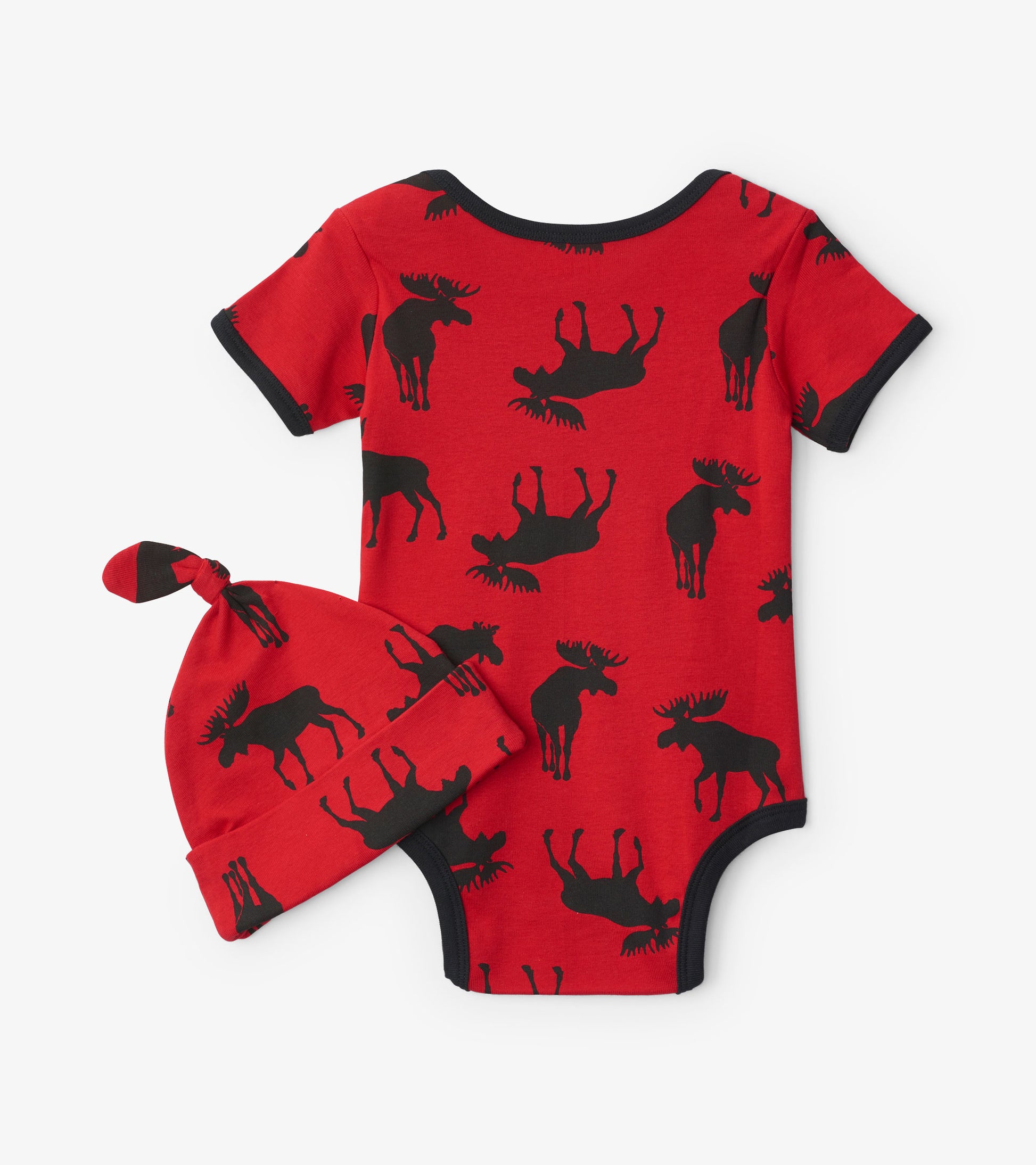 Red baby bodysuit with black moose print, paired with a matching knotted hat. Soft fabric, short sleeves, and round neckline.