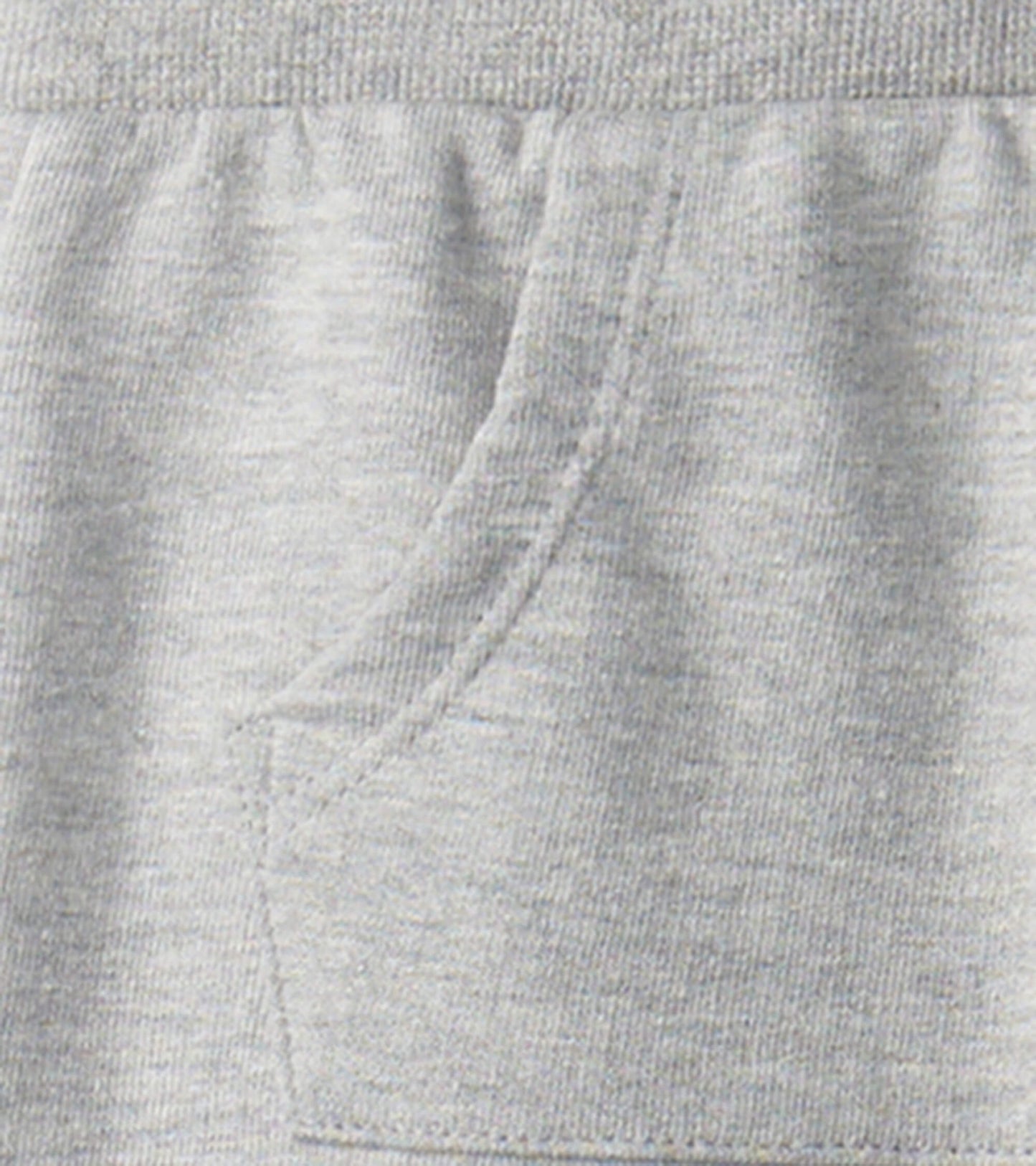 Grey melange joggers for baby and toddler boys, featuring an elastic waistband and side pockets. Soft, comfortable fabric.