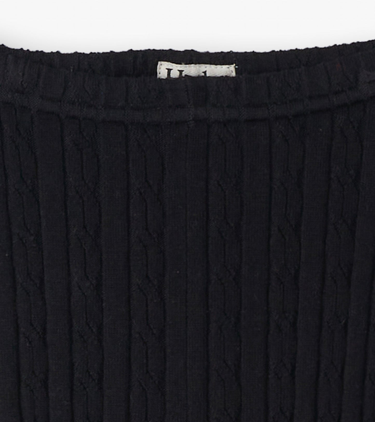 Black cable knit leggings with a textured pattern, featuring a stretchy waistband for comfort.