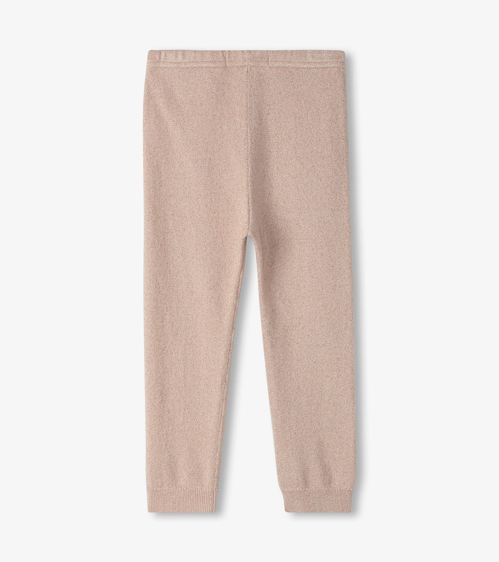 Gold glitter cable knit leggings in a soft pink hue, featuring a snug fit and elastic waistband.