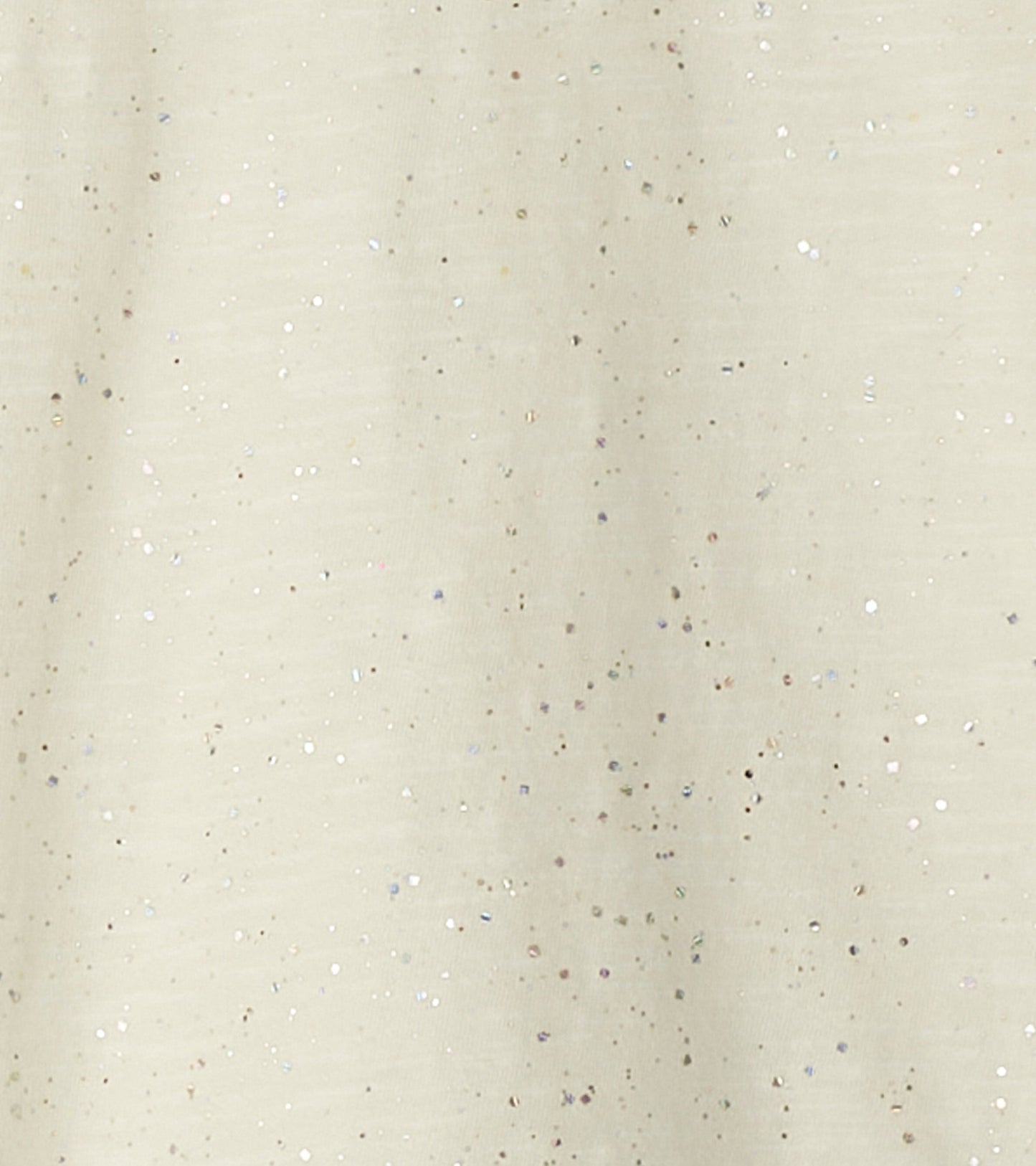 Light beige long sleeve graphic tee with a scattered glitter pattern.