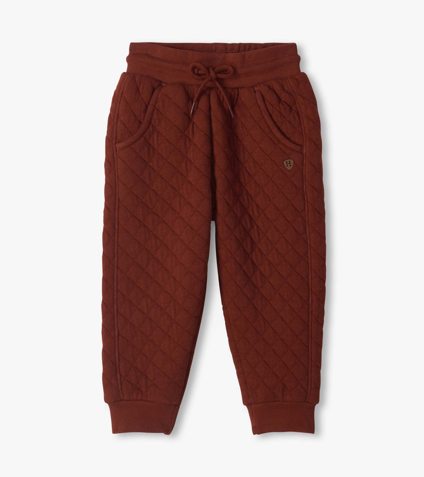 Madder brown quilted jogger pants with drawstring waist, side pockets, and ribbed ankle cuffs