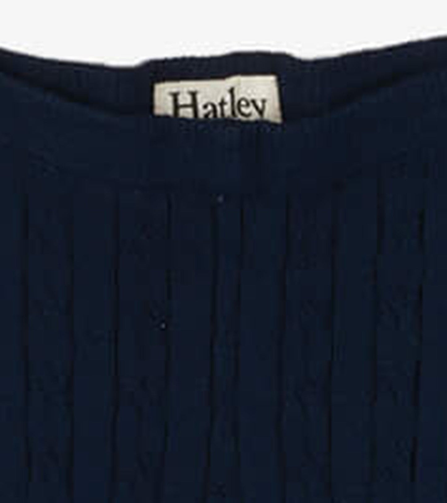 Navy cable knit tights with a textured pattern, suitable for girls in various sizes.