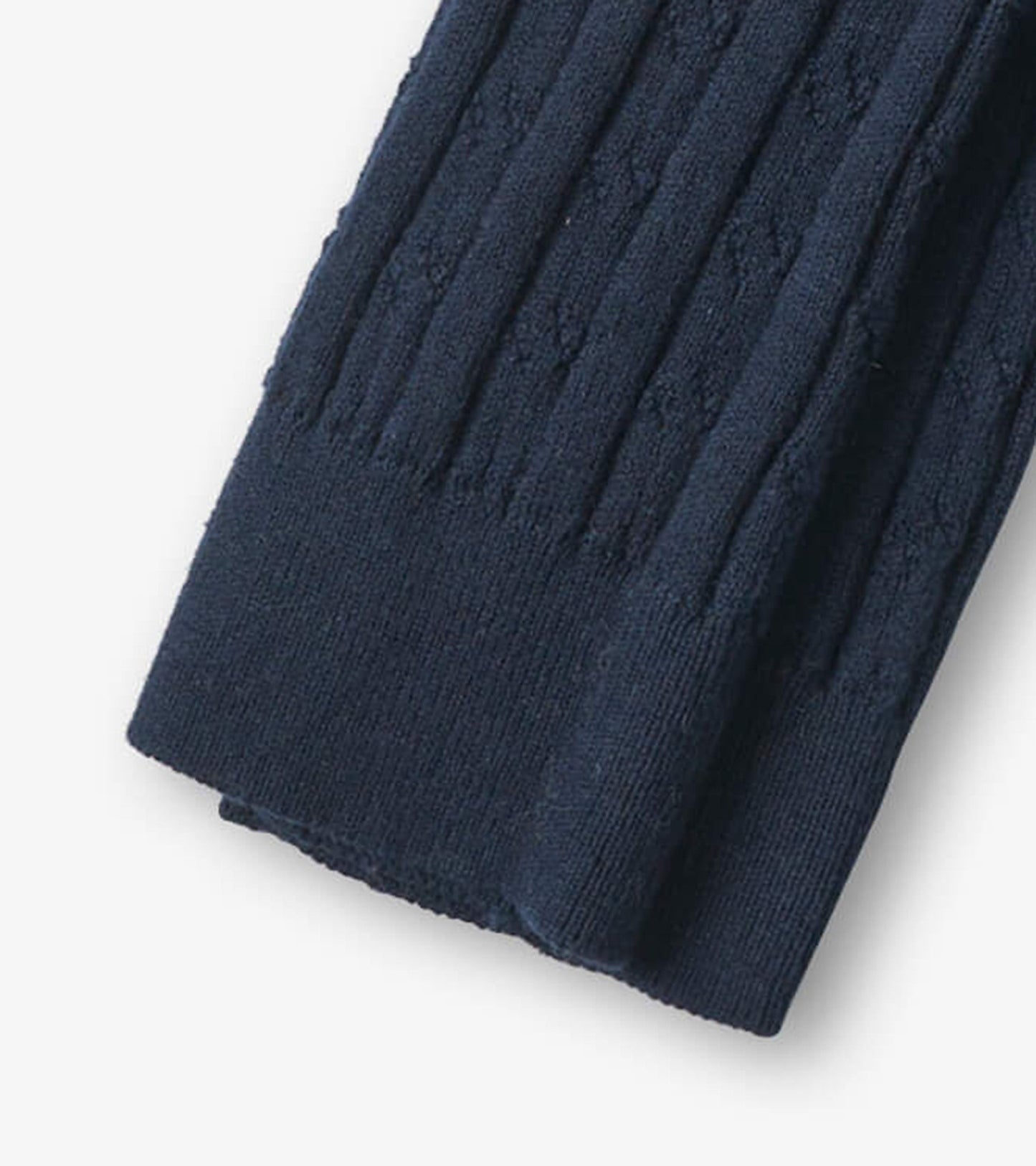 Navy cable knit tights with textured pattern, suitable for girls in various sizes.