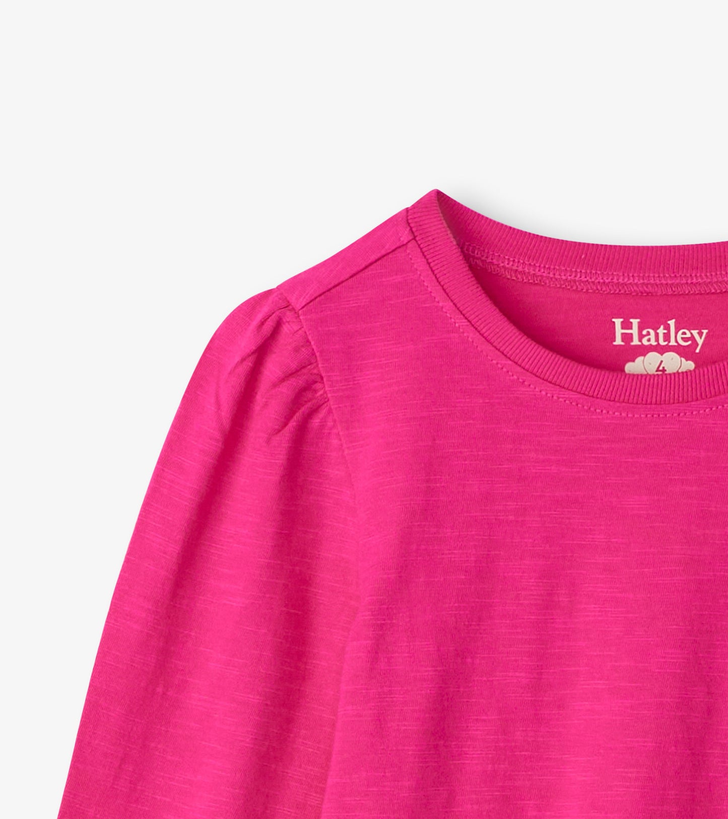 Bright pink long sleeve graphic tee with a round neckline and gathered shoulder detail.