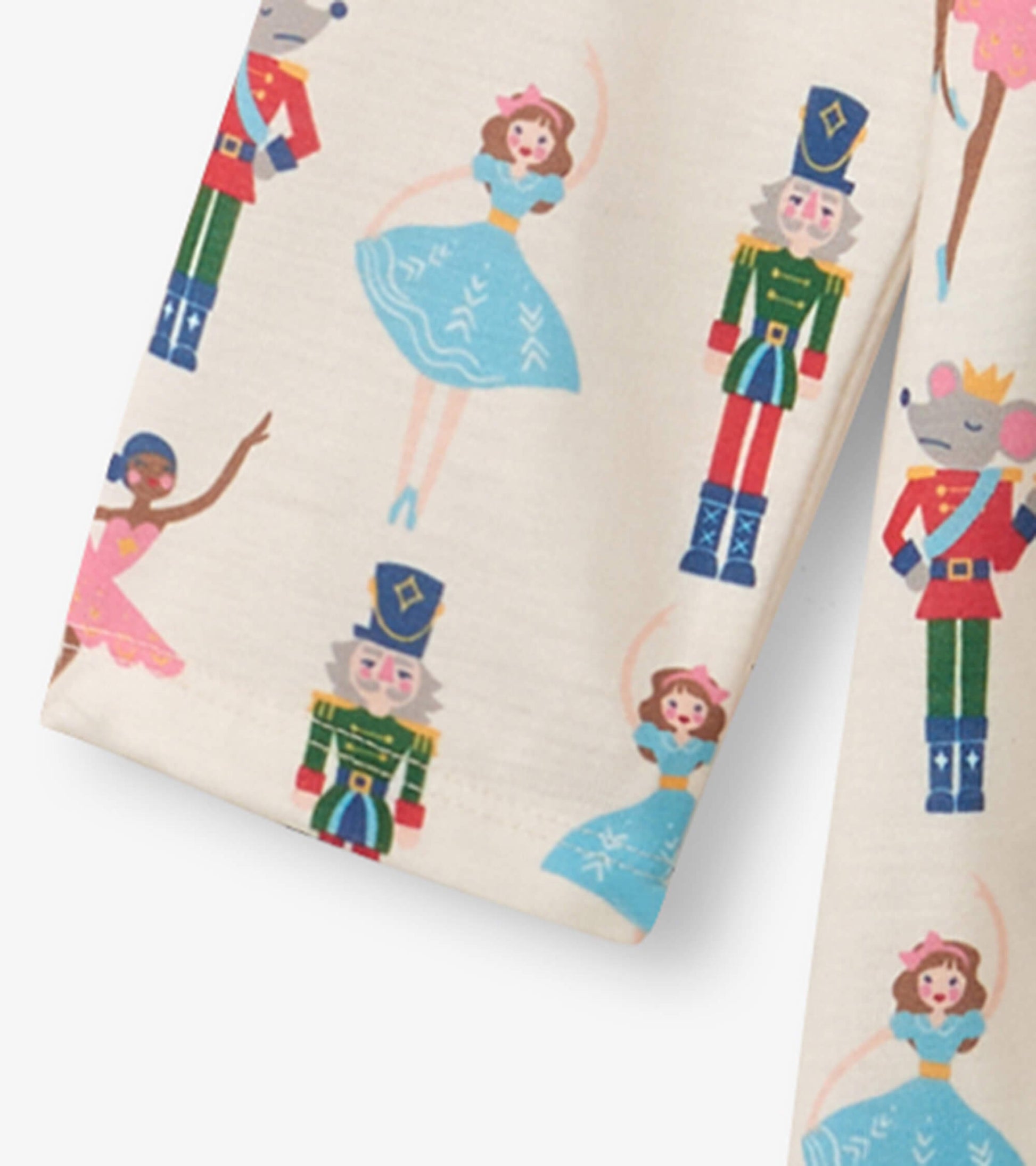 Cream long sleeve nightgown featuring colorful nutcracker and ballet dancer prints. Soft fabric, playful design for girls.
