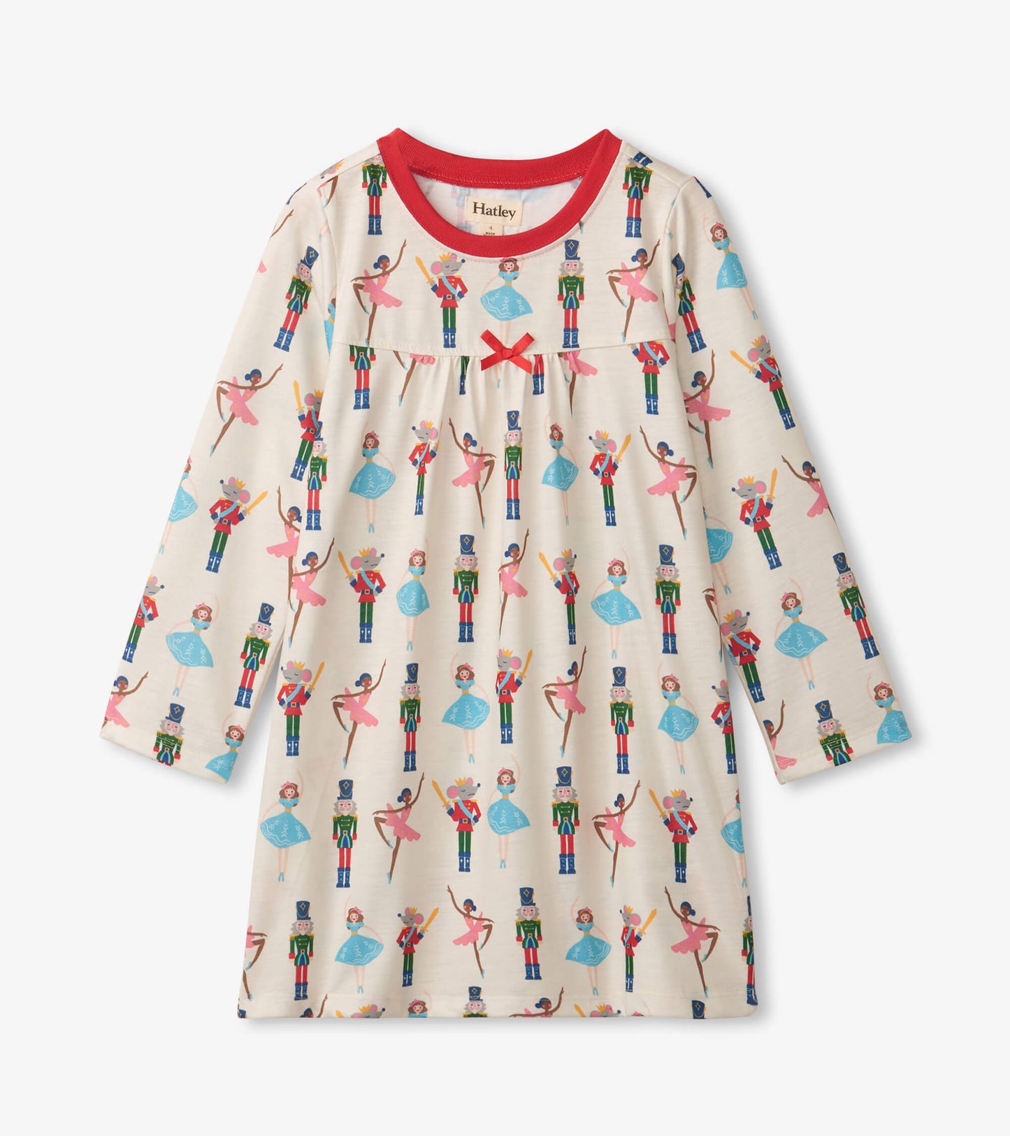Long sleeve girls' nightgown in cream with colorful nutcracker and ballet dancer print, featuring a red neckline and bow det…