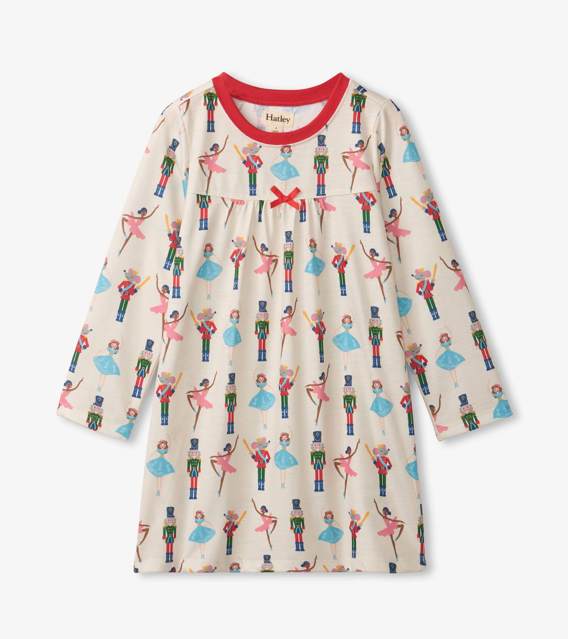 Long sleeve girls' nightgown in cream with colorful nutcracker and ballet dancer print, featuring a red neckline and bow det…