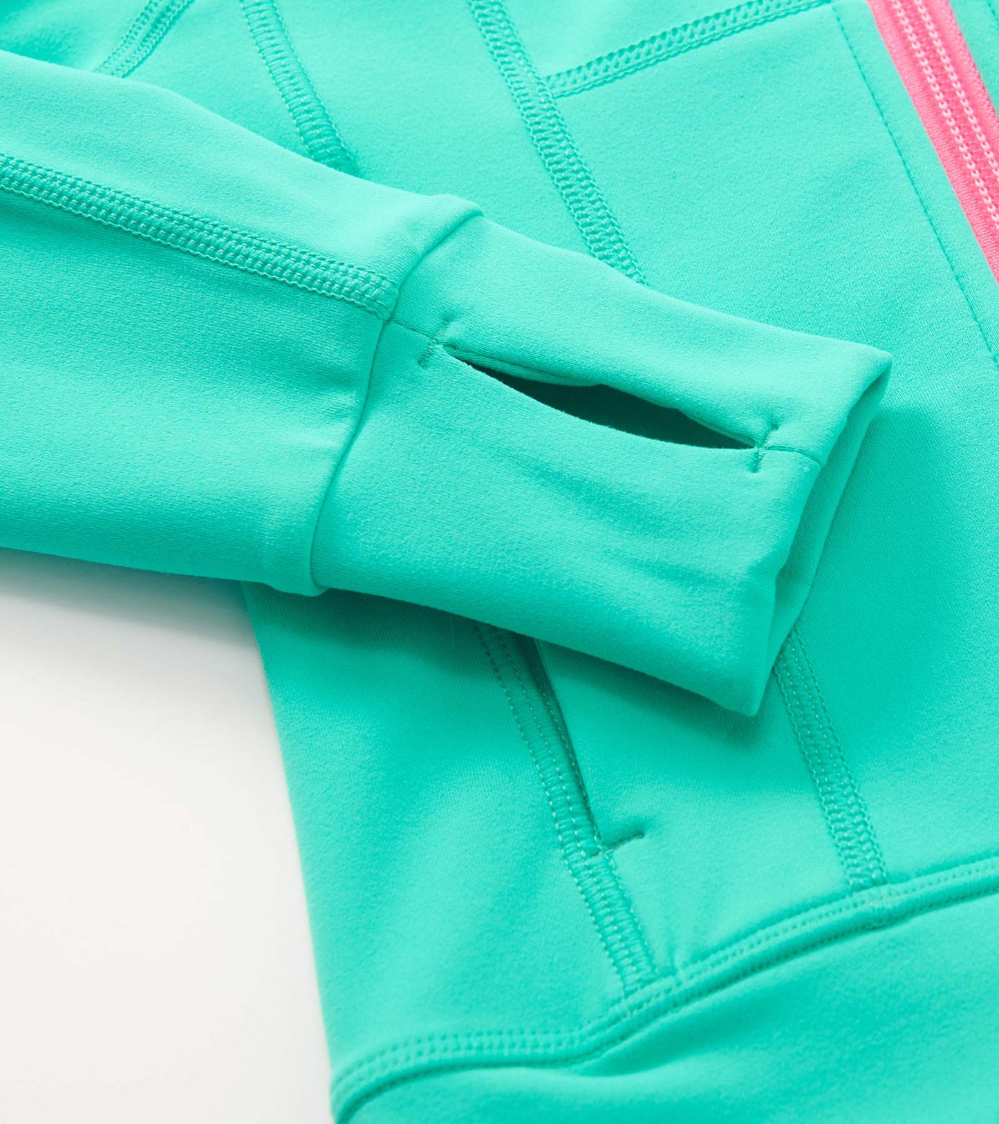 Aqua green active jacket with a soft texture, featuring a zip closure and thumbholes in the sleeves.