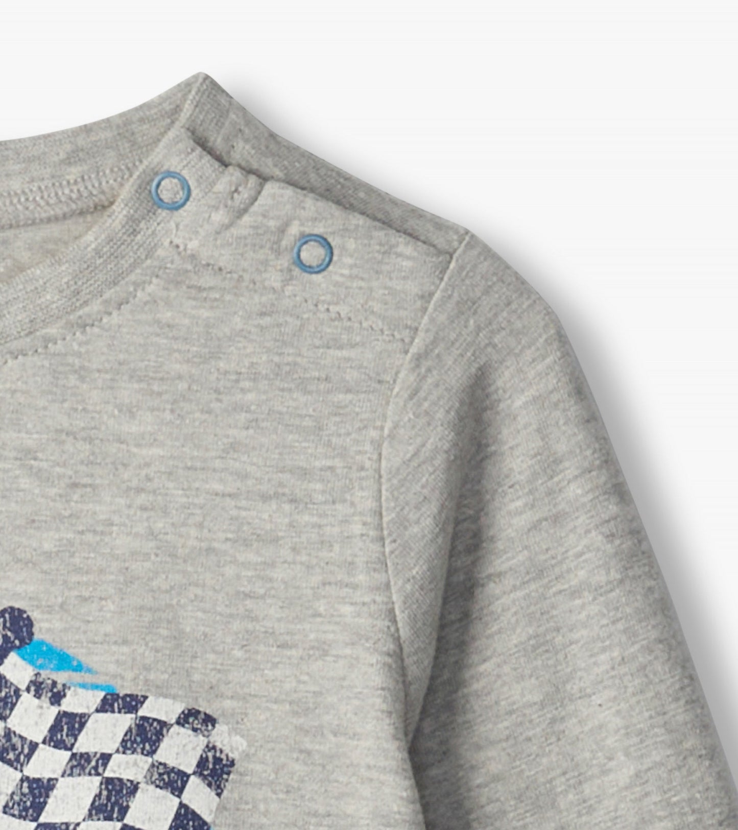 Gray long sleeve t-shirt featuring a checkered flag design and snap buttons at the shoulder for easy dressing.