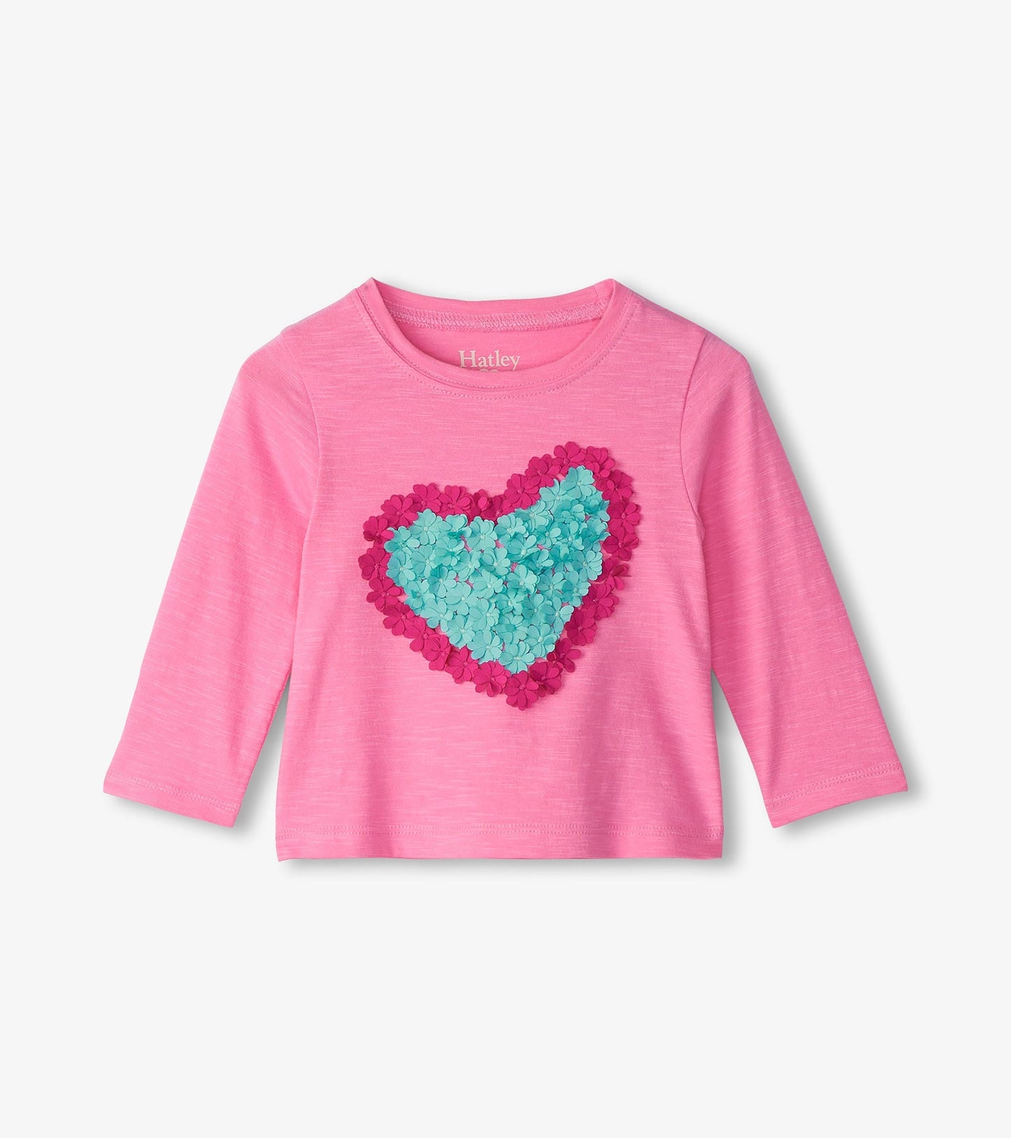 Pink long sleeve t-shirt featuring a textured heart design in turquoise and magenta. Suitable for baby and toddler girls.
