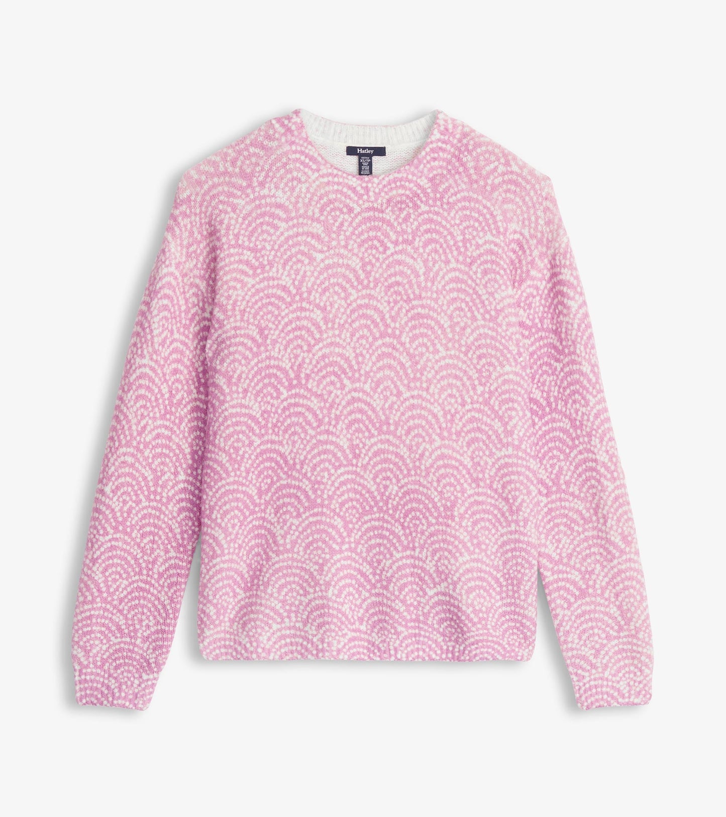 Light pink sweater featuring a decorative dot pattern, with a crew neckline and long sleeves.