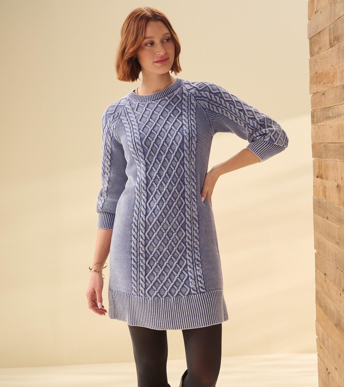 Bleached denim cable knit dress with three-quarter sleeves and a relaxed fit, featuring a textured diamond pattern.
