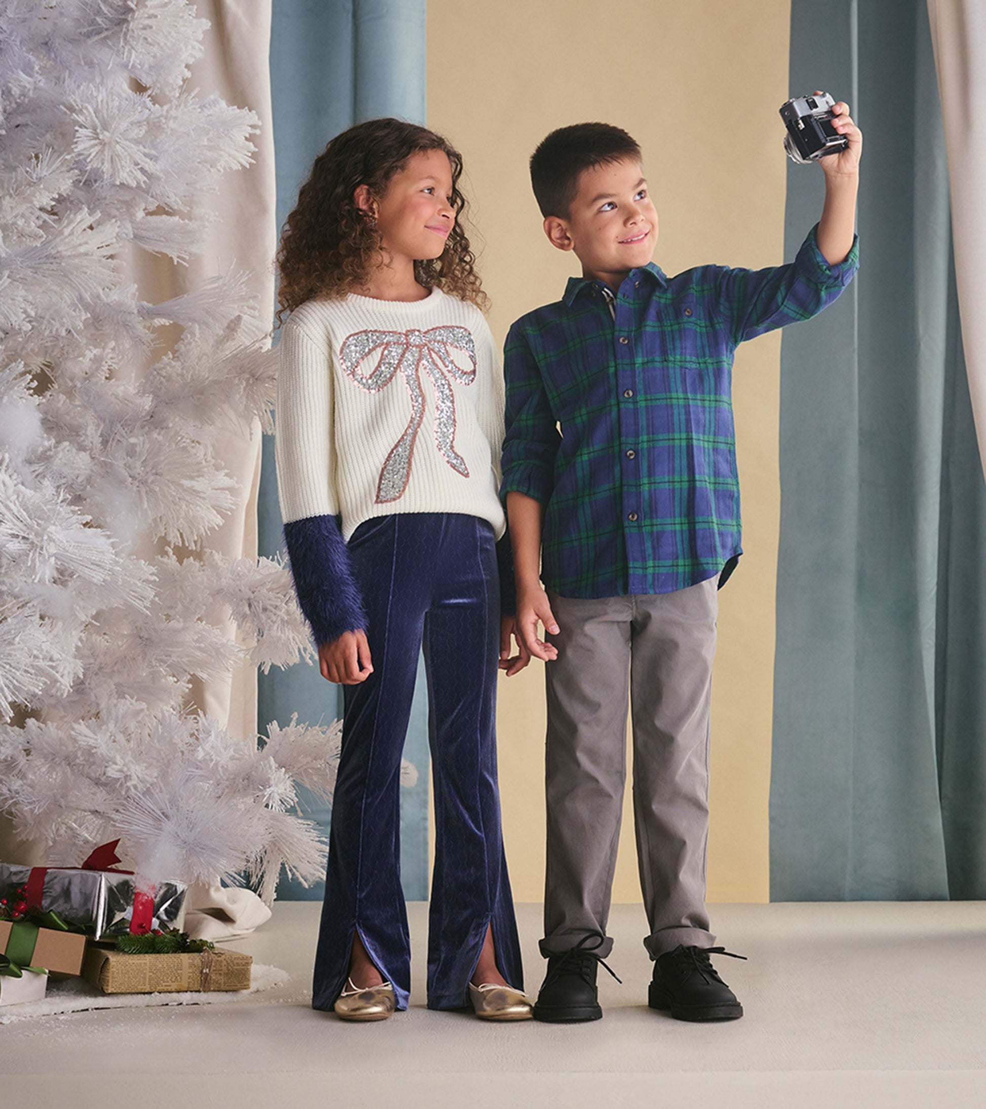 Boys' button-down shirt in blackwatch plaid pattern, featuring green and blue tones, suitable for casual wear.