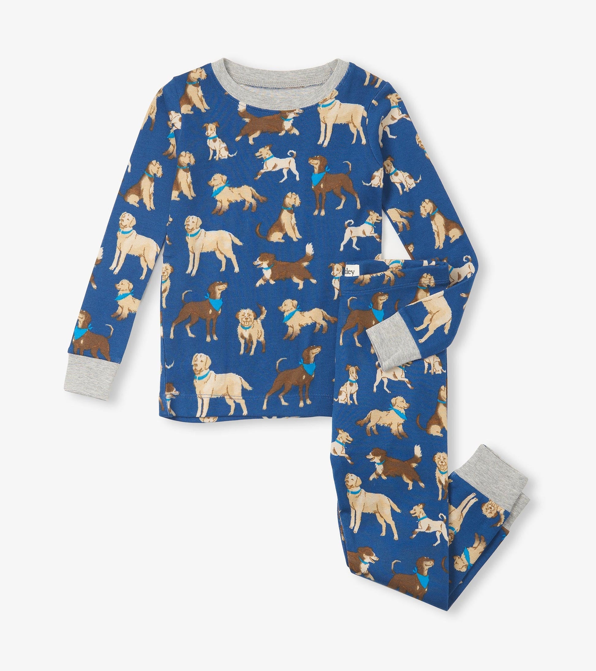 Blue organic cotton pajama set featuring various dog prints, with gray cuffs on the long-sleeve top and pants.