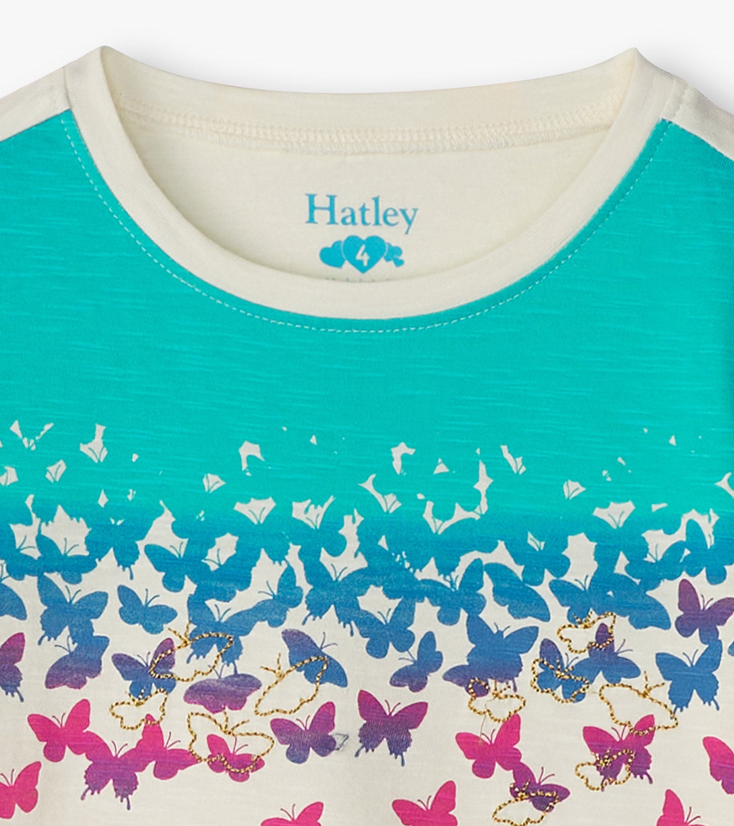 Long sleeve graphic tee featuring a gradient turquoise top and colorful butterfly print in pink and purple at the bottom.