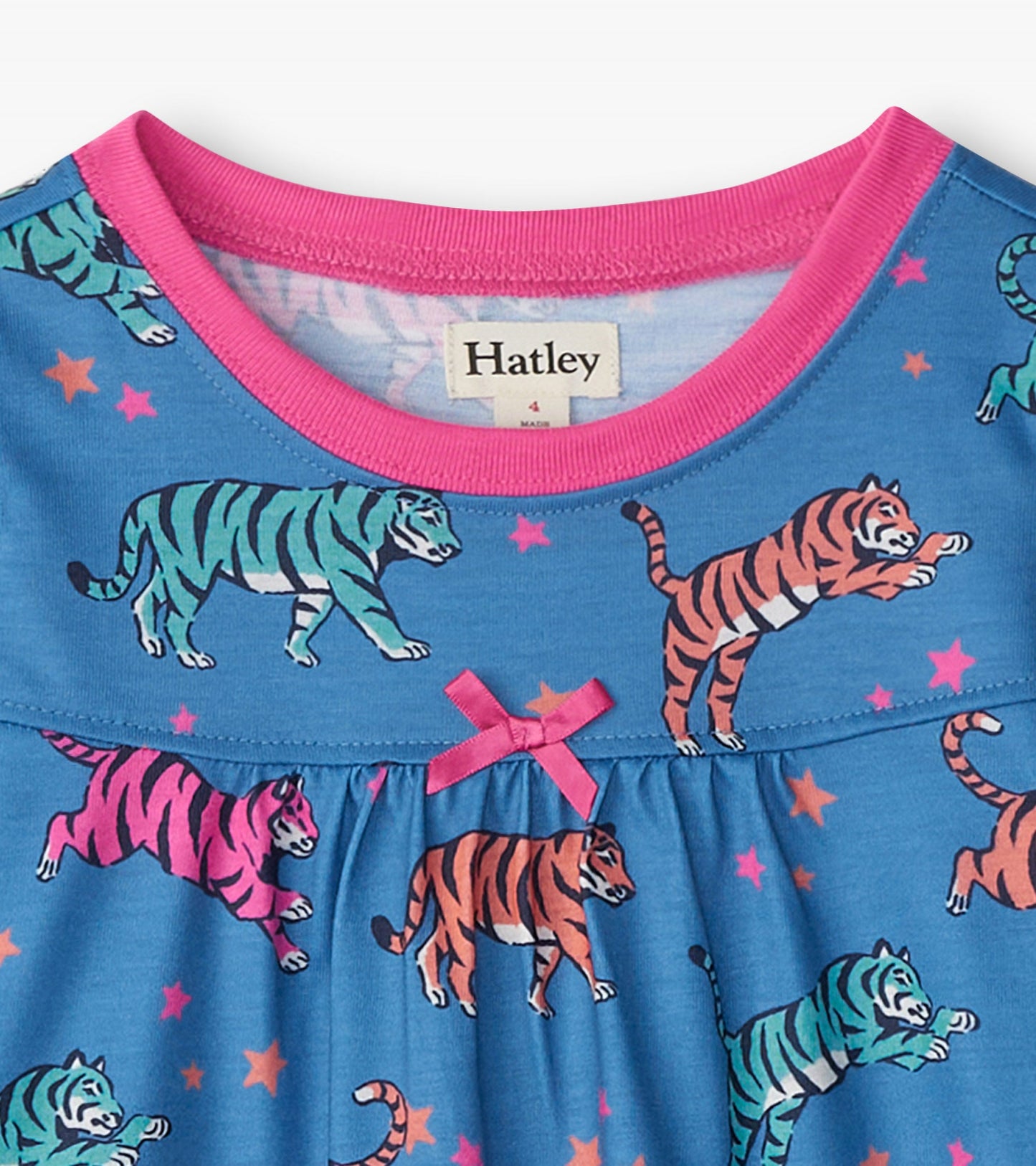 Blue nightgown featuring playful tiger prints and pink star accents, with a pink neckline and a small bow detail.