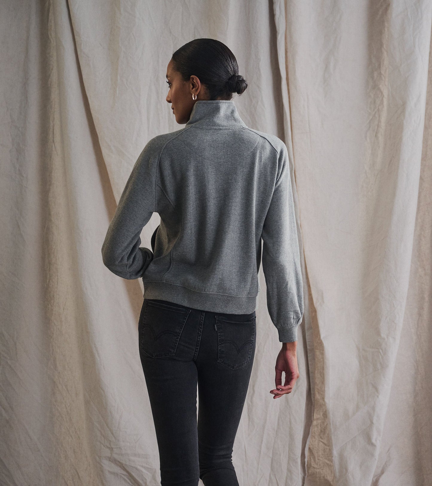 Charcoal heather mock neck pullover with a relaxed fit and ribbed hem, viewed from the back.
