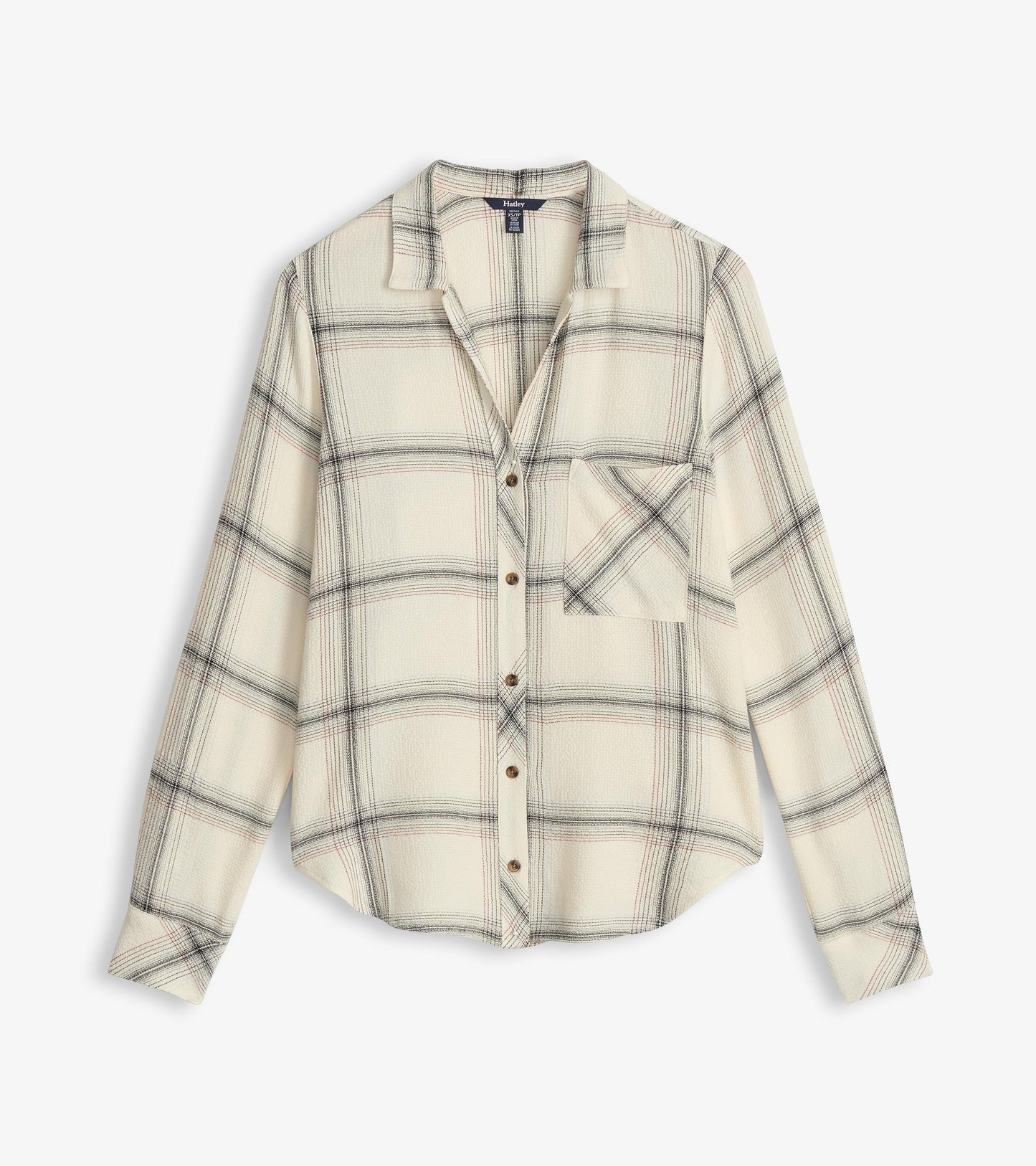 Cream plaid button-down shirt with long sleeves and a chest pocket. Features a relaxed fit and rounded hem.