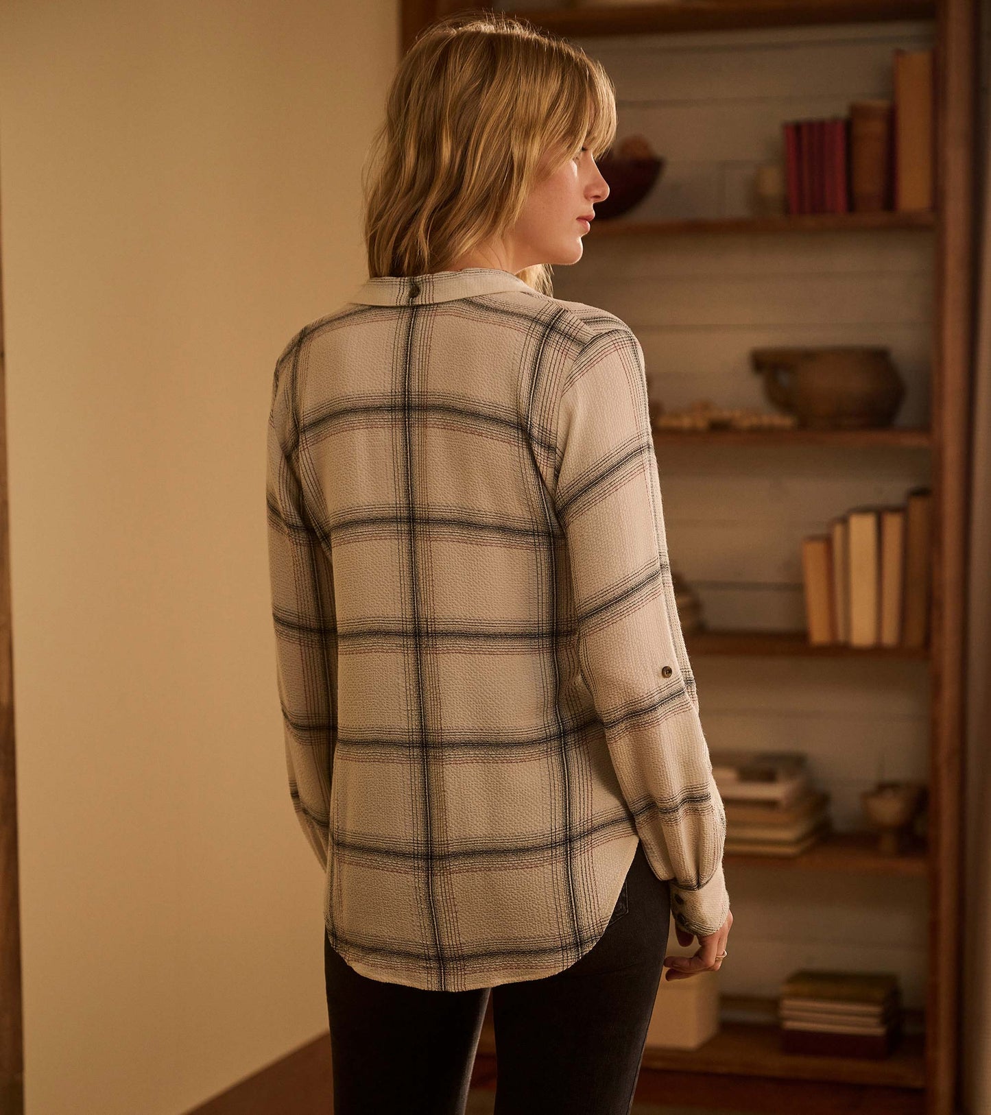 Cream plaid button-down shirt with long sleeves, featuring a relaxed fit and rounded hem, viewed from the back.