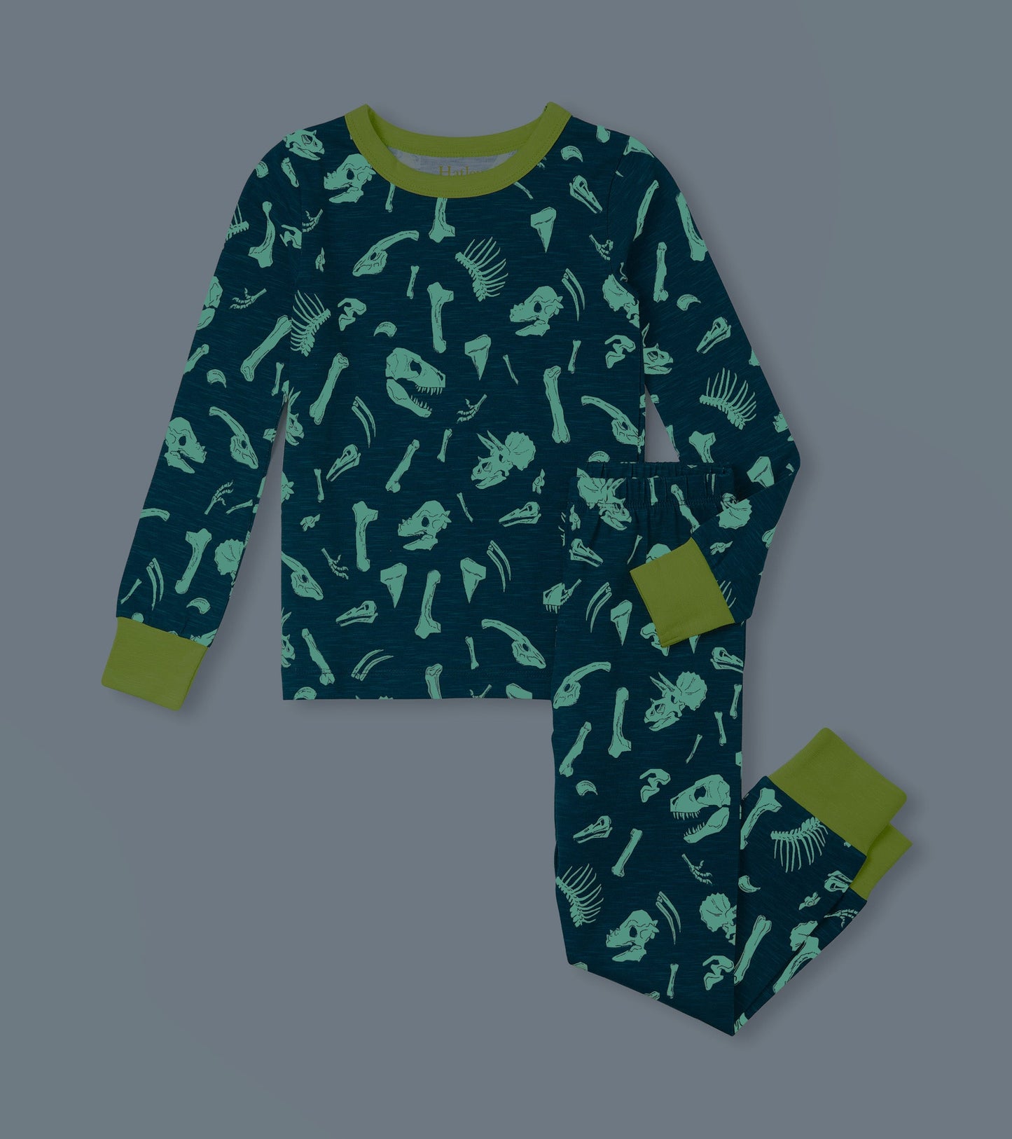 Navy pajama set featuring green dinosaur fossil prints, with long sleeves and matching pants, ideal for sleepwear.