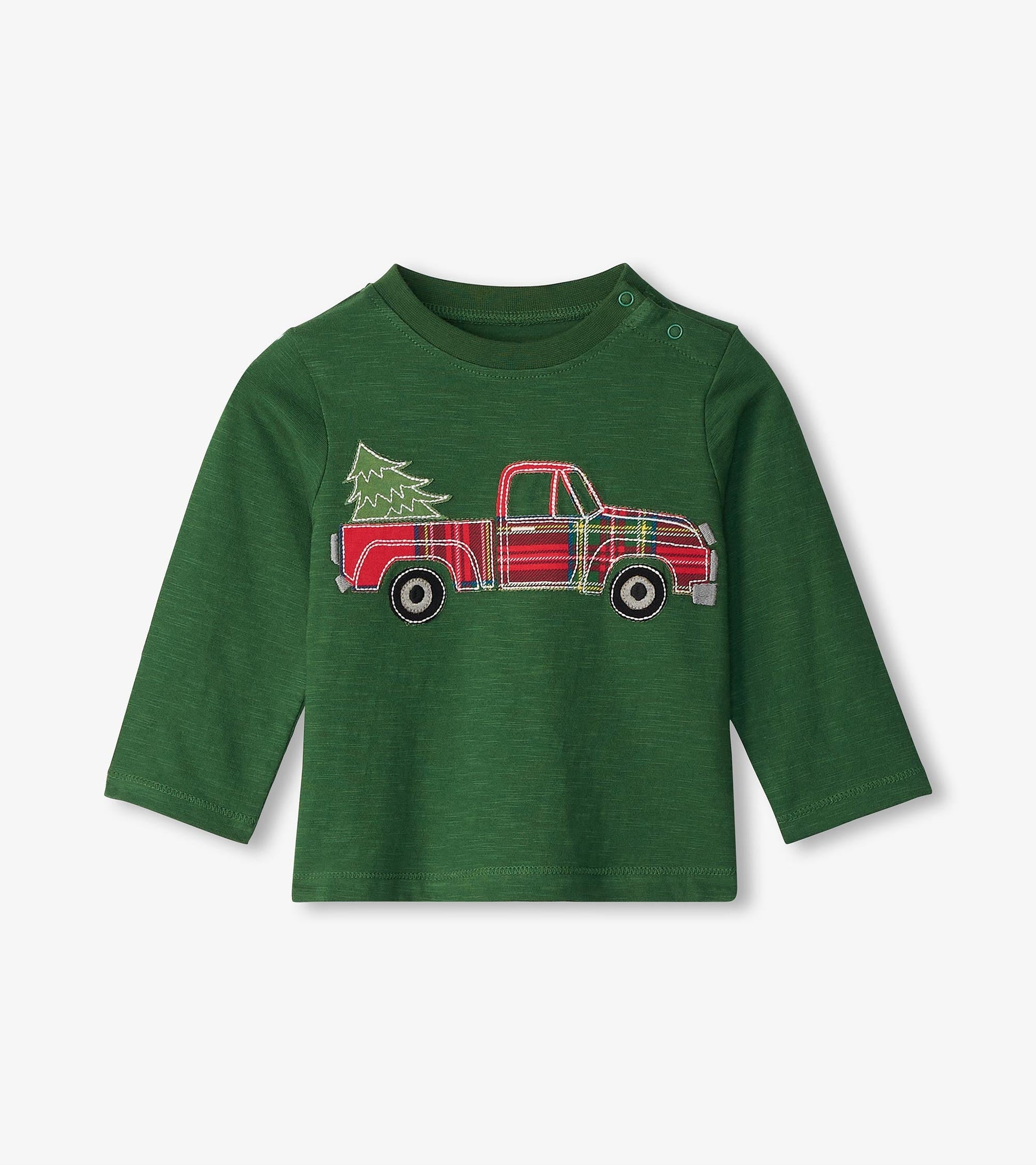 Green long sleeve t-shirt featuring a red plaid truck with a Christmas tree design on the front.