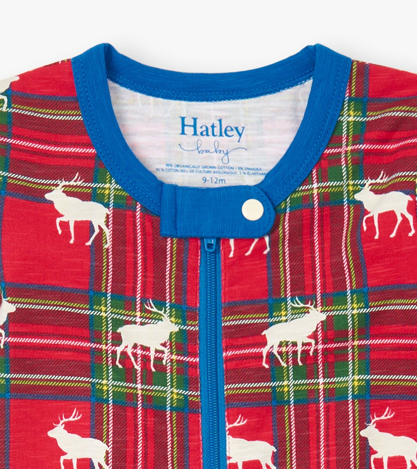Red plaid cotton footed sleeper featuring white elk designs and a blue snap closure at the neck. Size 9-12M.