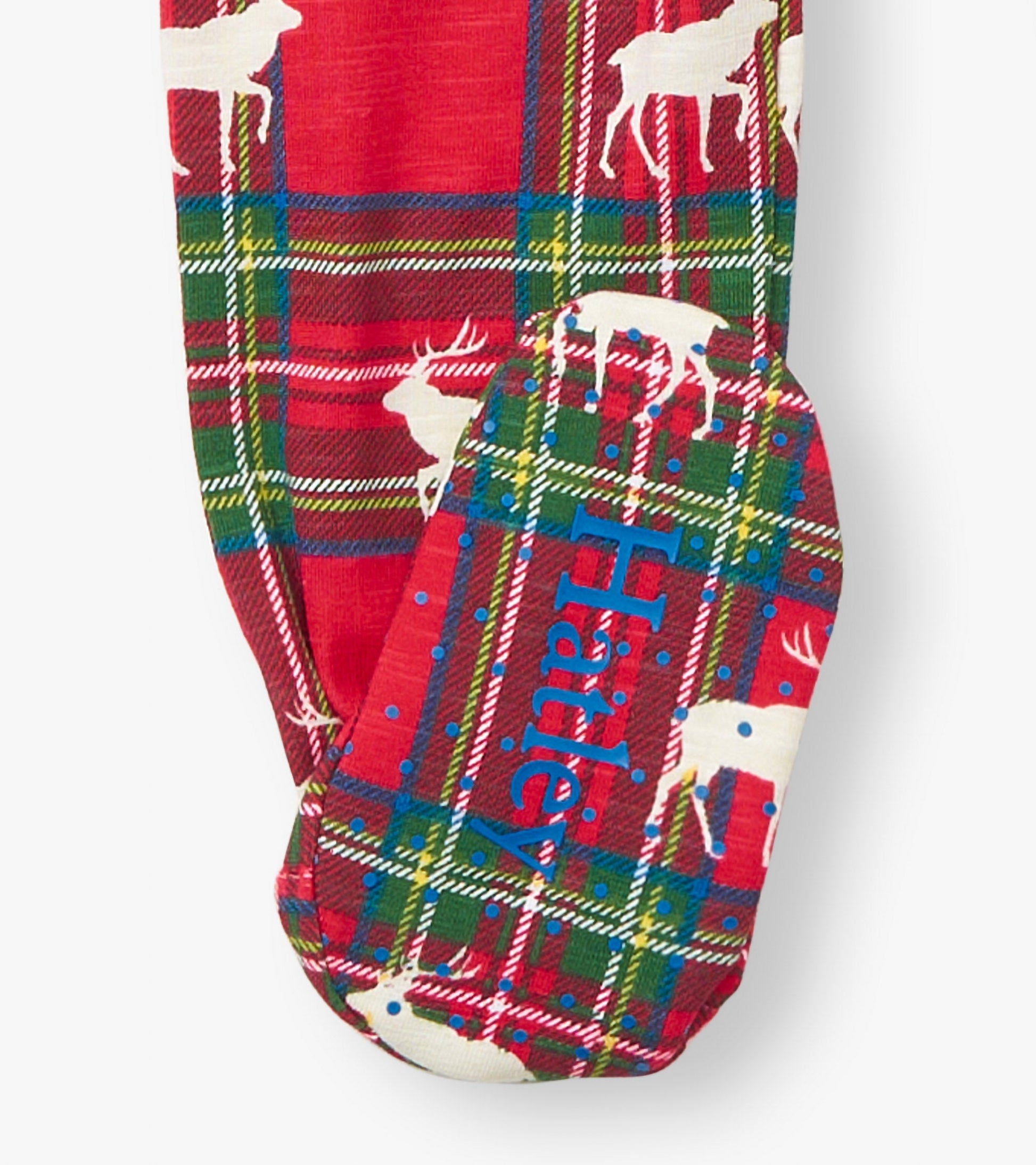 Red plaid cotton footed sleeper featuring white elk silhouettes and blue accents on the foot. Suitable for infants.