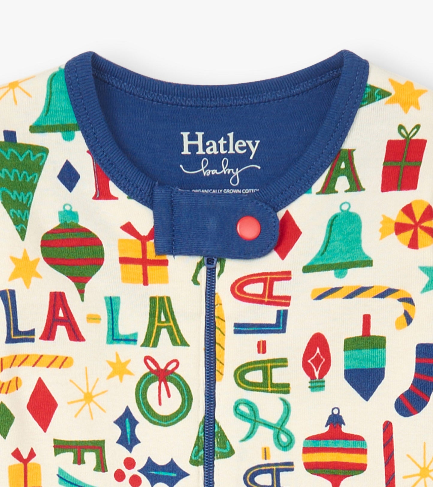 Baby blue cotton footed sleeper with colorful holiday-themed patterns and a navy collar, featuring a front zipper closure.