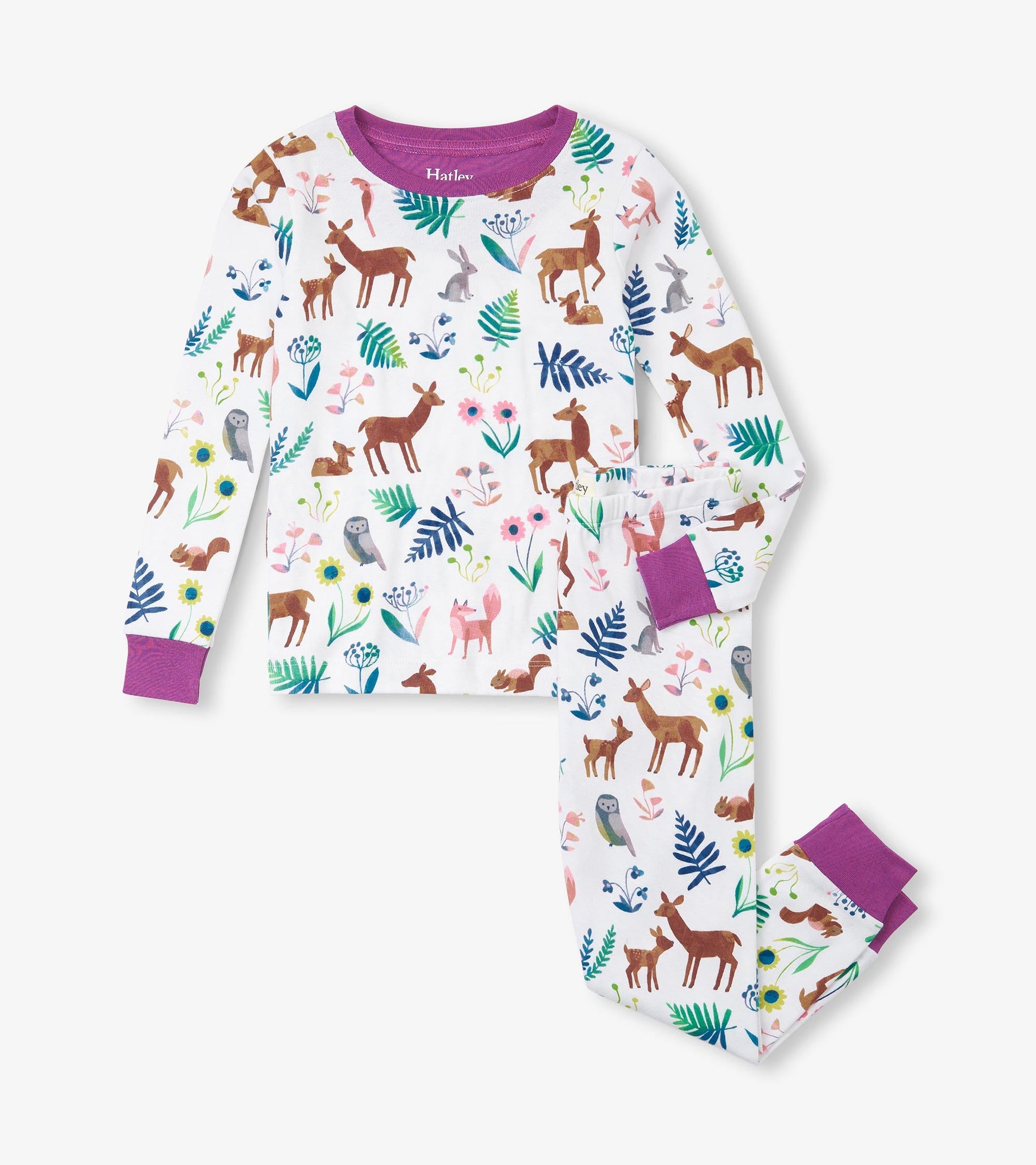 Organic cotton pajama set featuring a colorful forest creatures print with purple cuffs and trim.