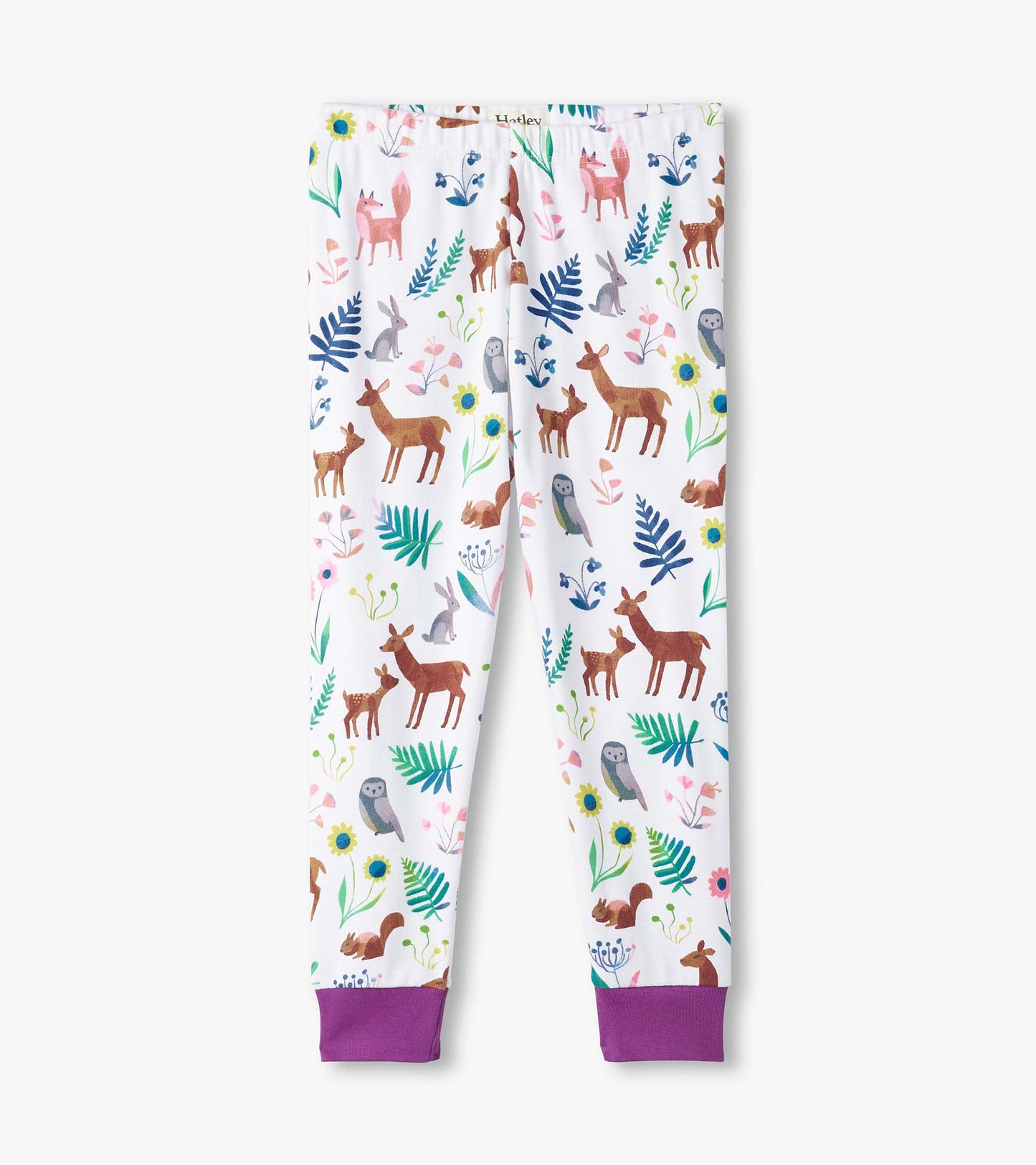 White pajama pants featuring colorful forest creature prints and purple cuffs, made from organic cotton.