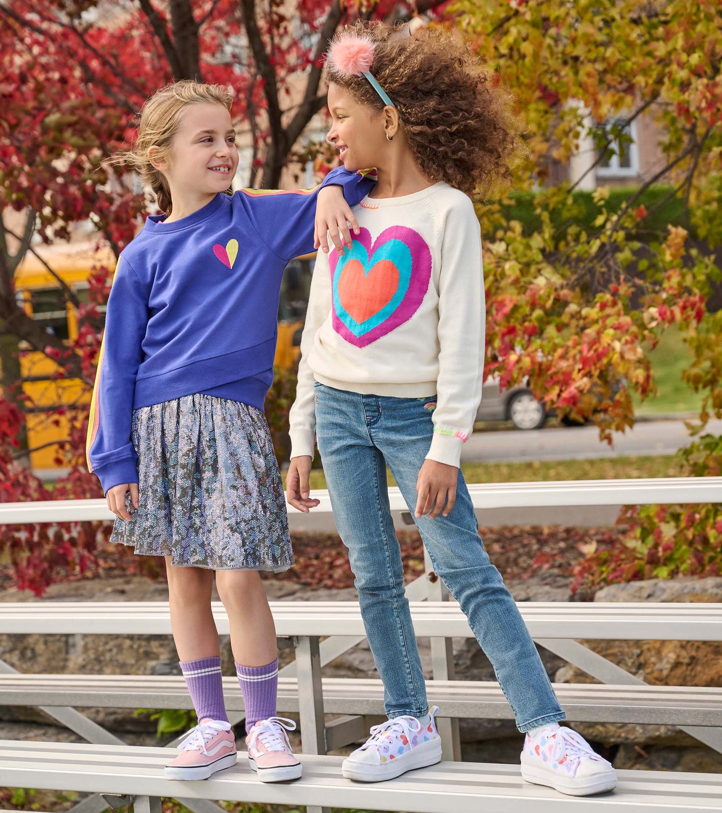 Girls' tulle skirt with shimmering sequins, featuring a floral pattern, paired with colorful tops and casual sneakers.