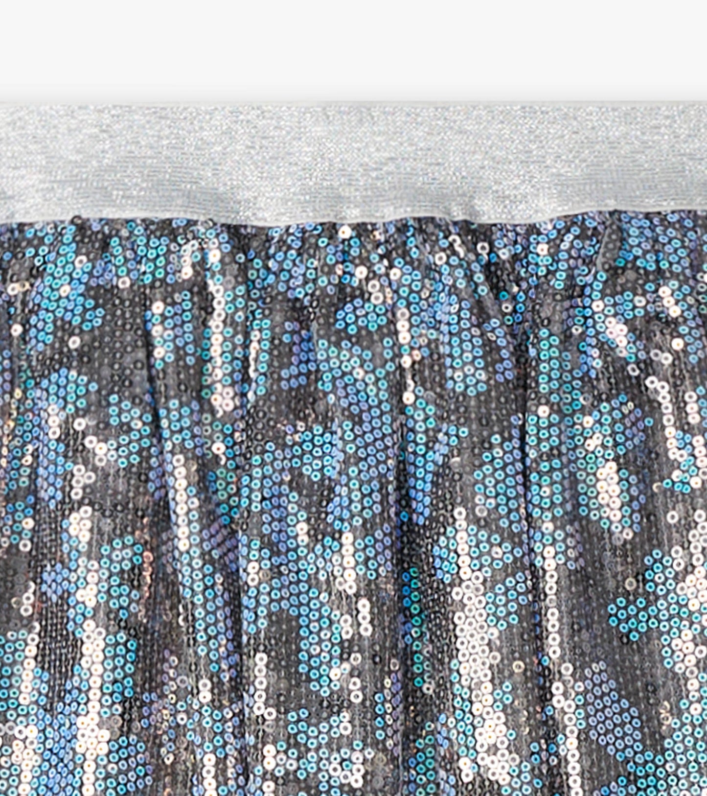 Shimmering tulle skirt with blue and silver sequins, featuring an elastic silver waistband.