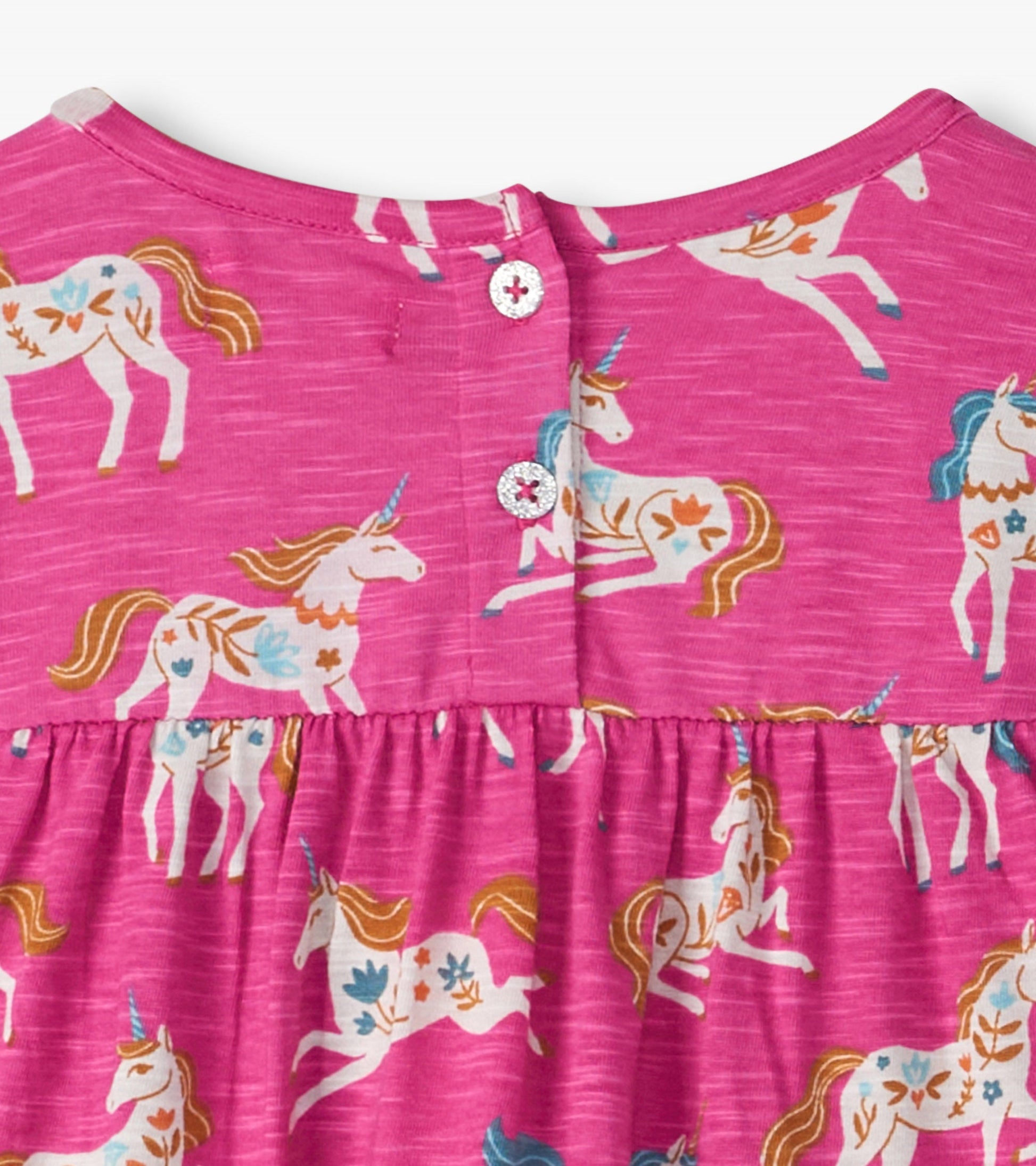 Pink gathered tiered dress featuring a unicorn pattern and button closure at the back, suitable for baby and toddler girls.
