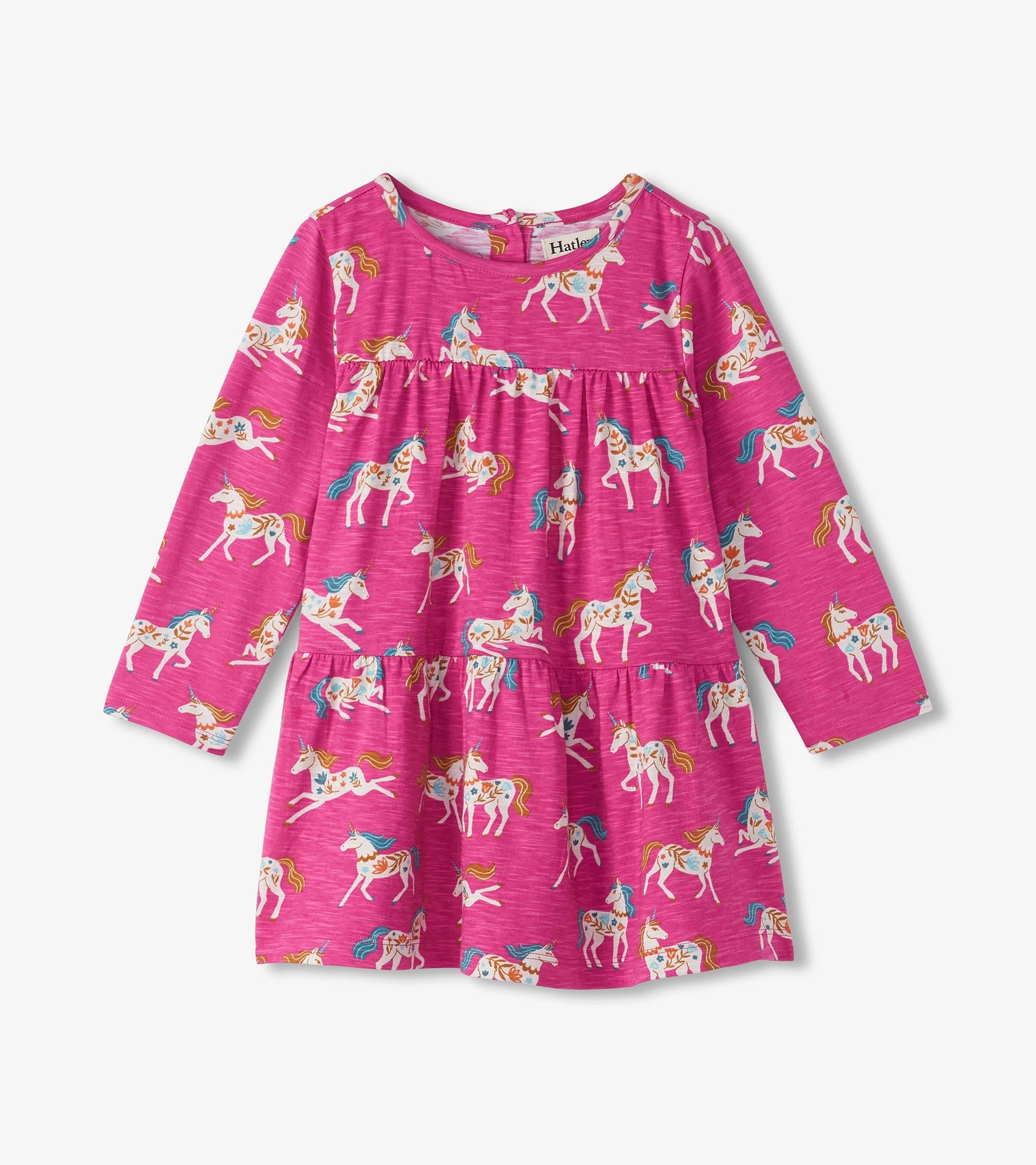 Pink gathered tiered dress featuring a whimsical unicorn print, long sleeves, and a round neckline.