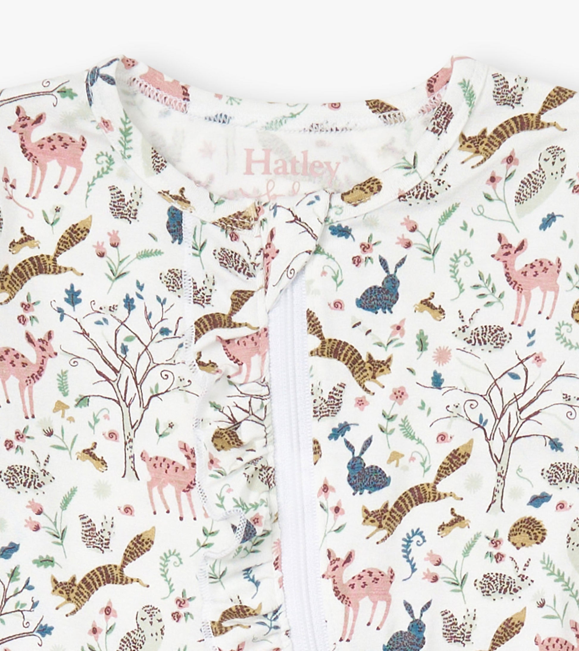 White bamboo sleeper featuring a colorful forest animal print with ruffles along the zipper. Suitable for baby girls.