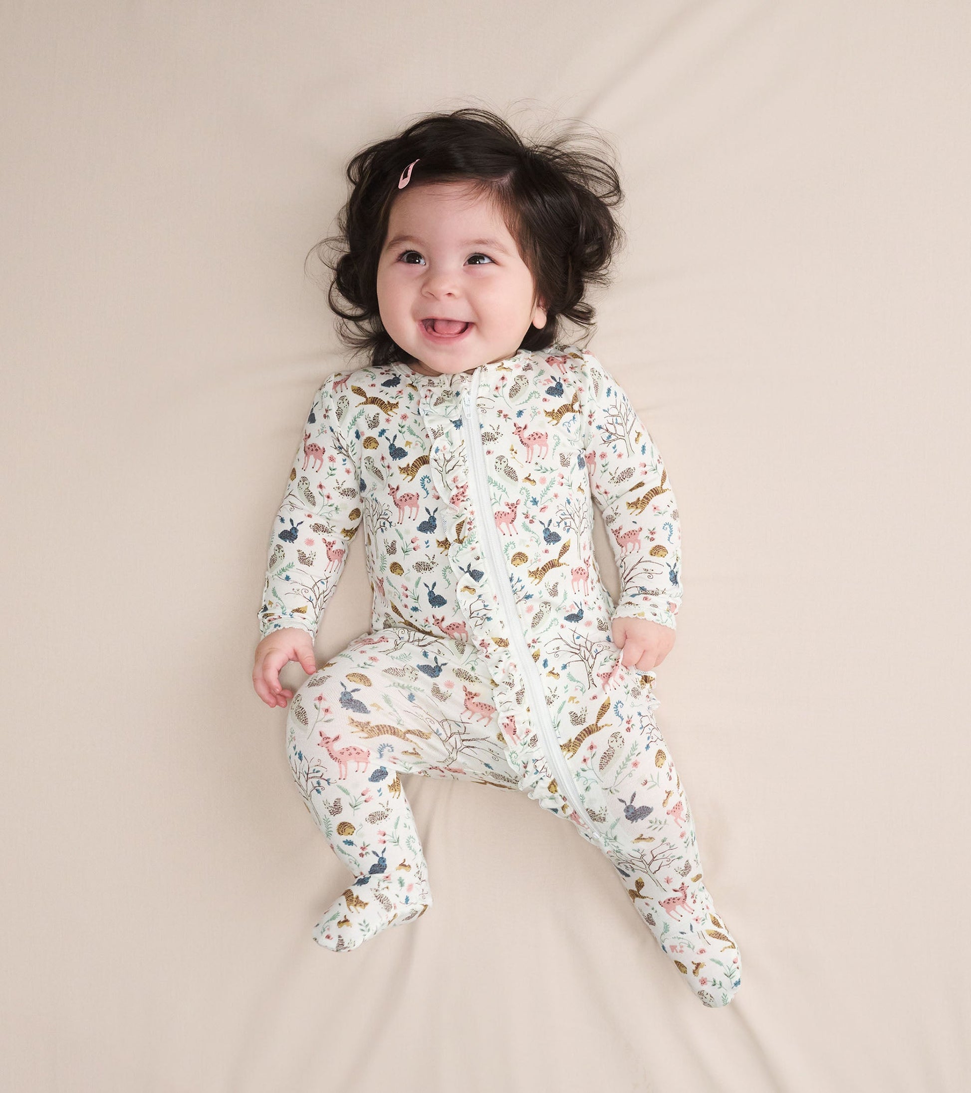 Bamboo sleeper for baby girls featuring a colorful forest animal print and a front zipper, perfect for cozy wear.