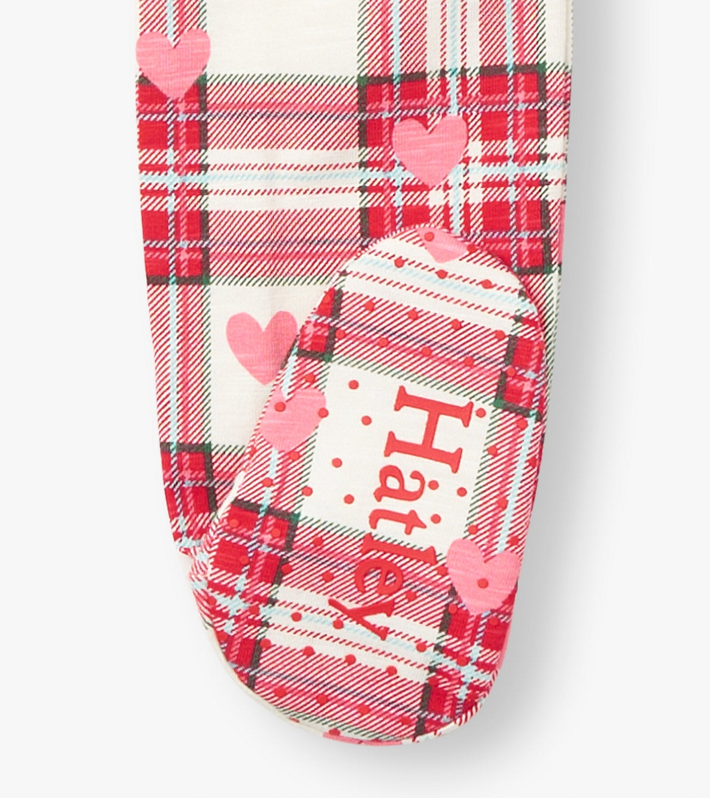 Red and white plaid footed sleeper with heart patterns, featuring a soft cotton material and a cozy design for infants.