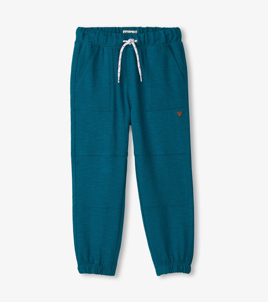 Cozy boys' pants in Moroccan blue, featuring an elastic waistband, drawstring, and side pockets.