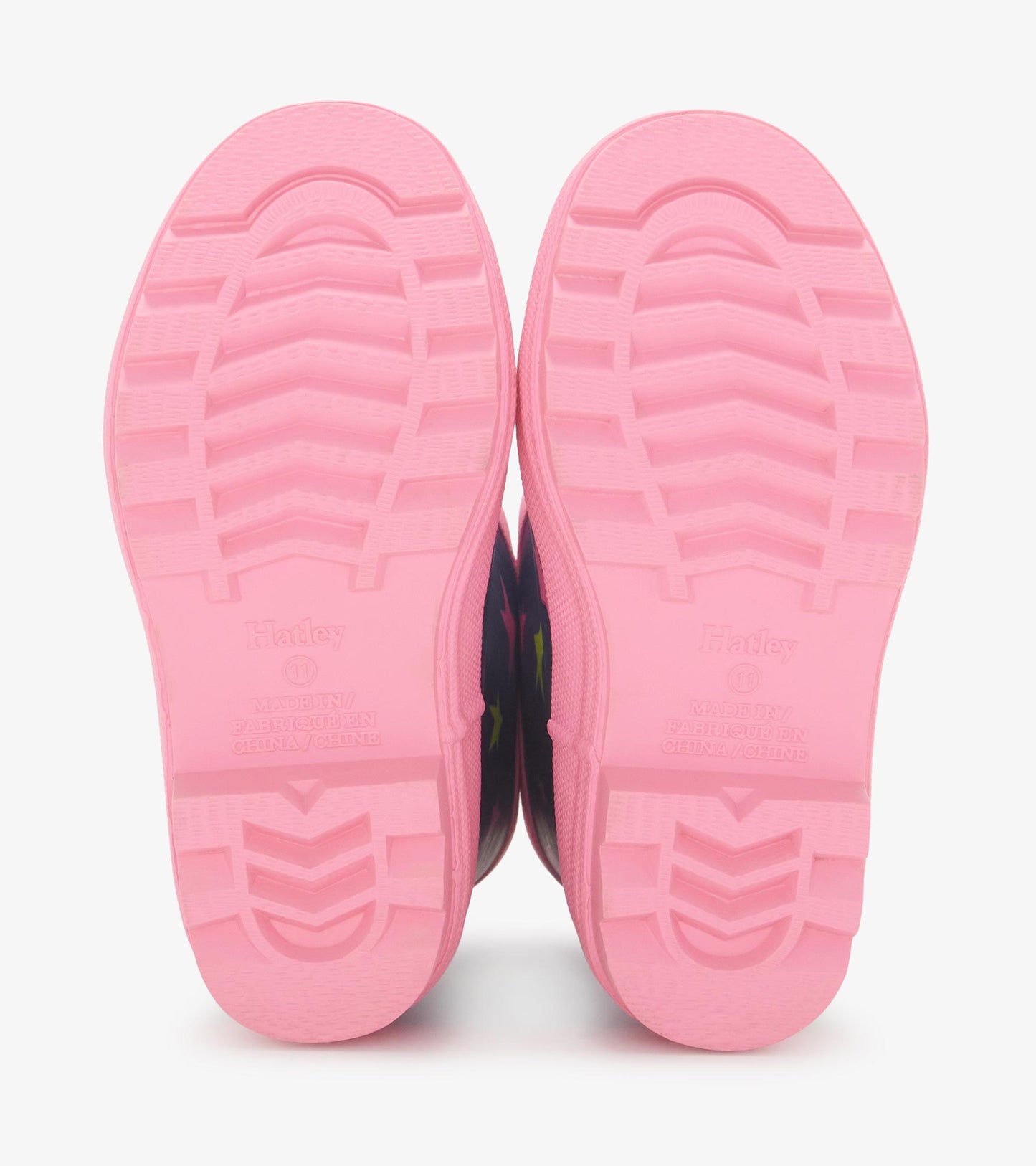 Pink-soled matte rain boots featuring an ombre design with colorful stars, suitable for girls.